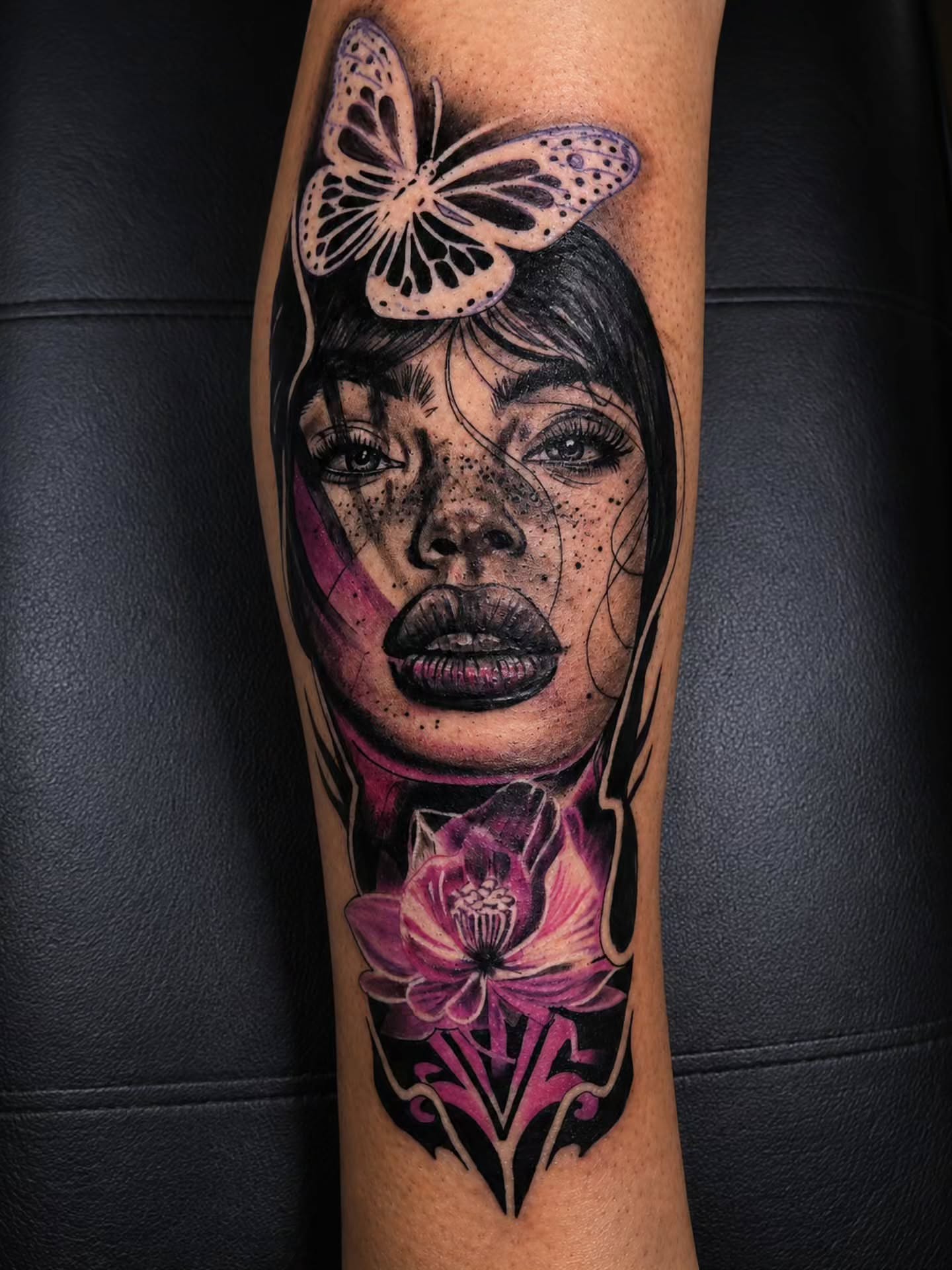 Woman's face with butterfly dotwork tattoo on the forearm by Sonia