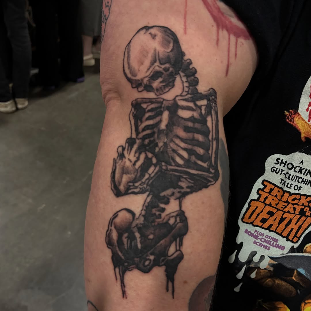 Skeleton black and grey tattoo on the forearm by Heather Freitag
