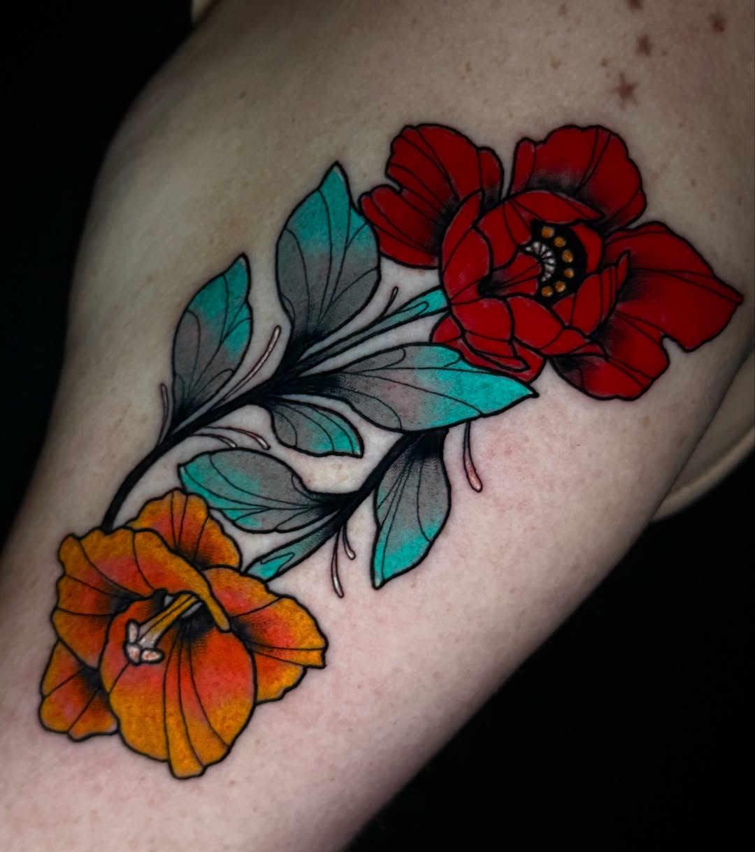 Flowers new school tattoo on the upper arm by Exploitedtattoos