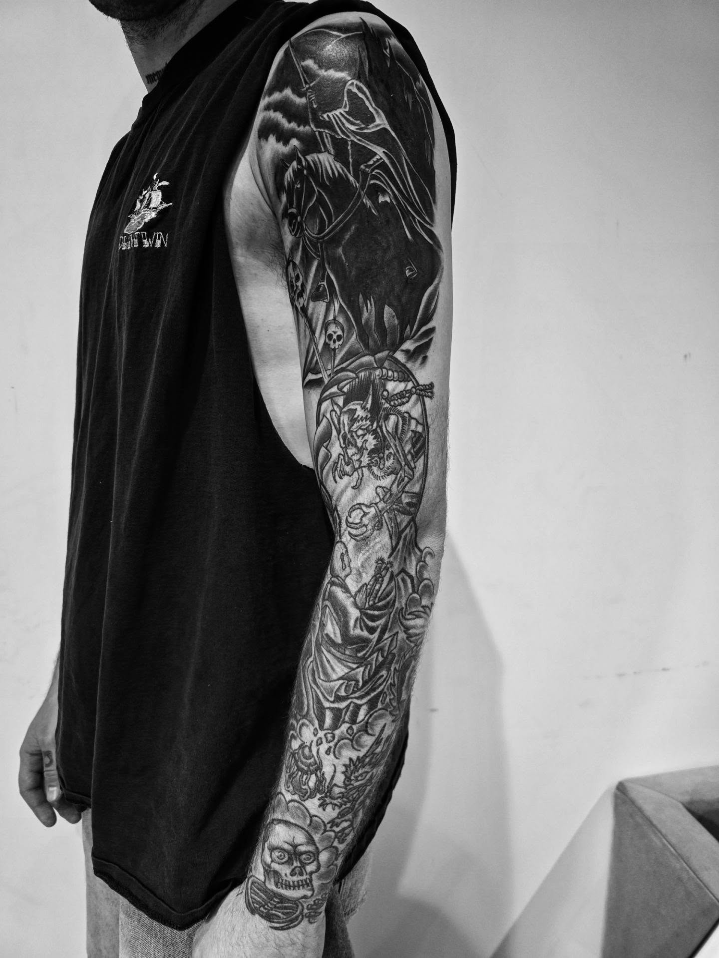 Skeleton and rider realism tattoo on the upper arm by Tattoo Artist, Orange, California