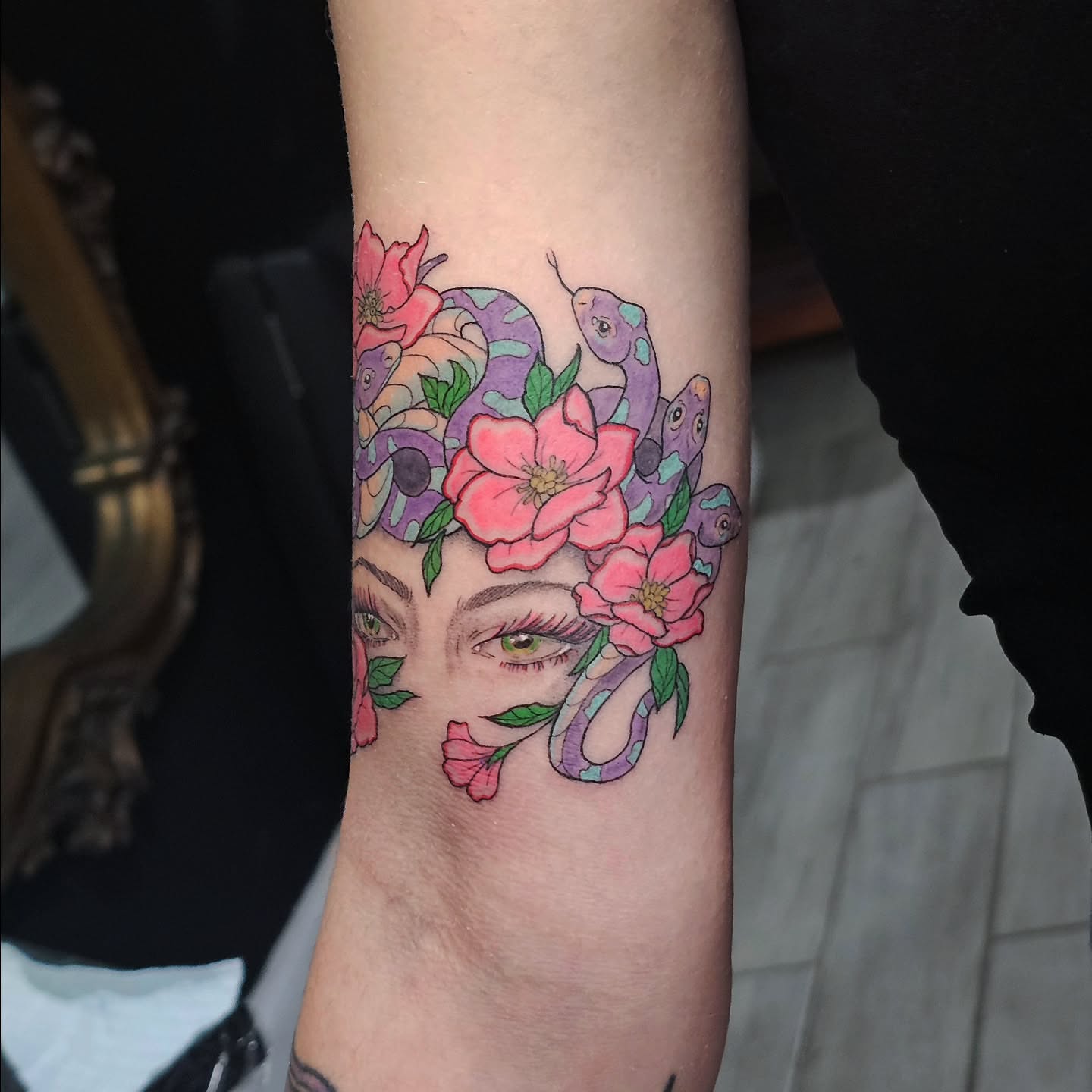 Snake and peony new school tattoo on the forearm by Casey Jo