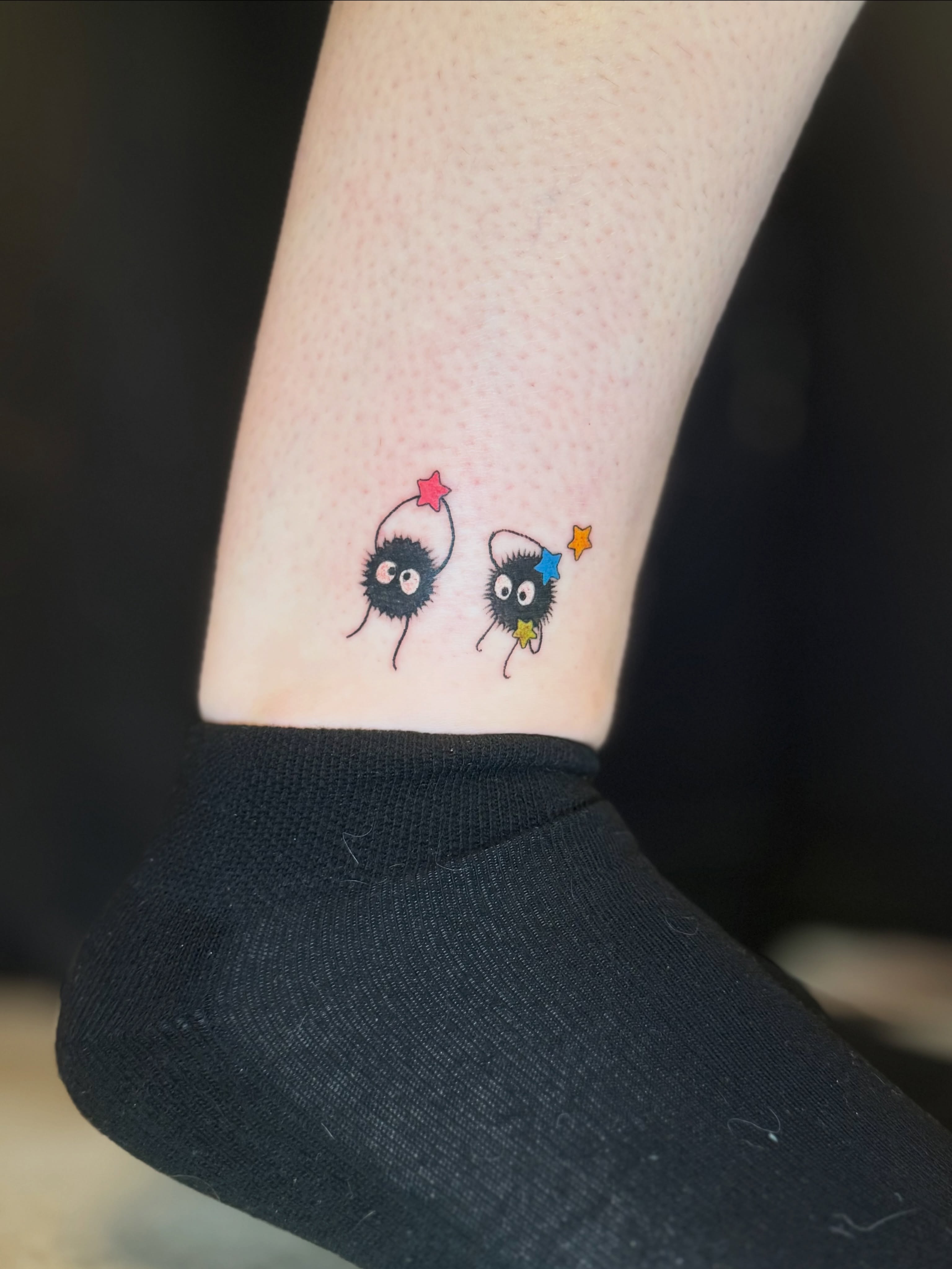 Two cute characters dotwork tattoo on the forearm by Olivia, Royal Oak, Michigan