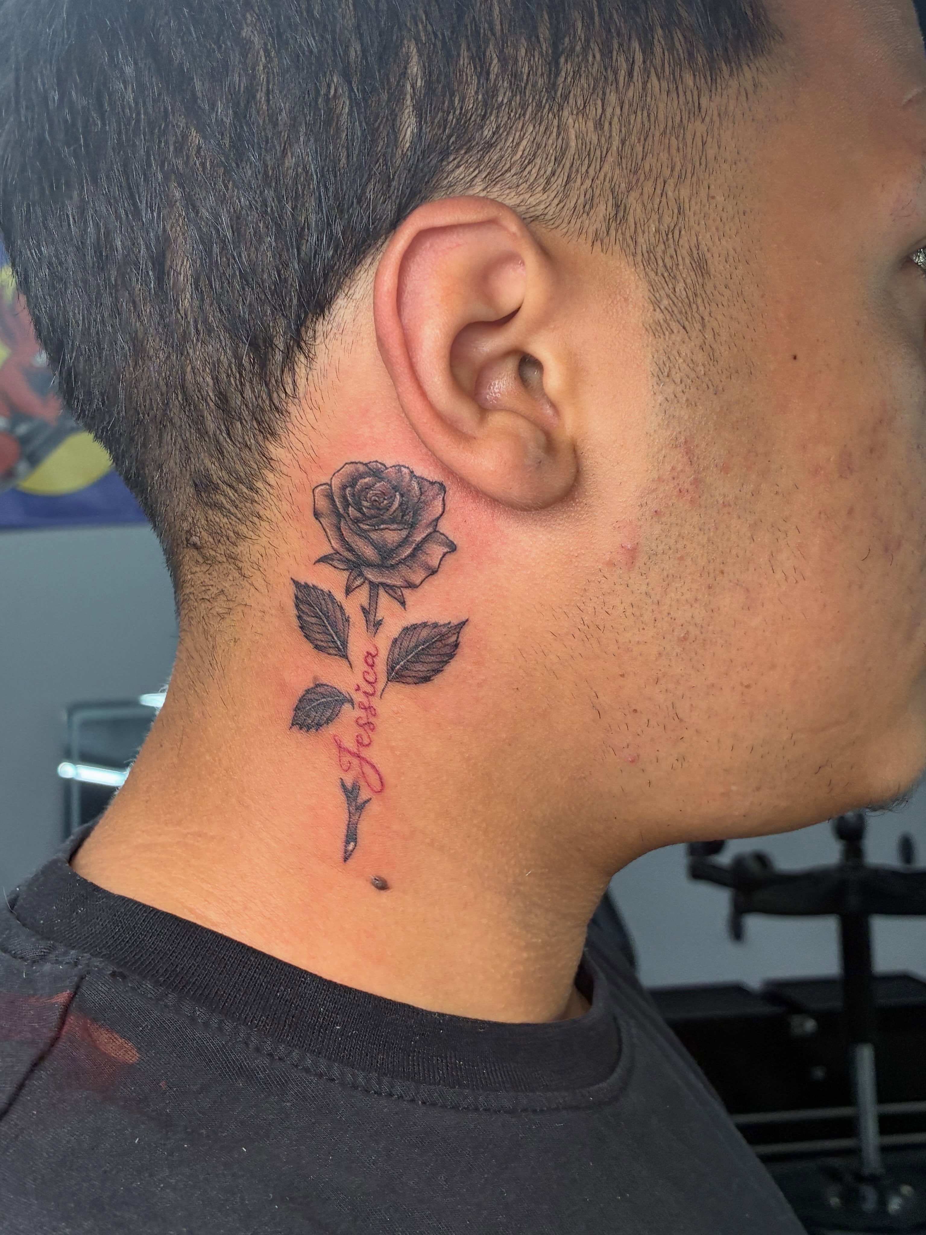 Rose black and grey tattoo on the neck by Tattoos by Hailey