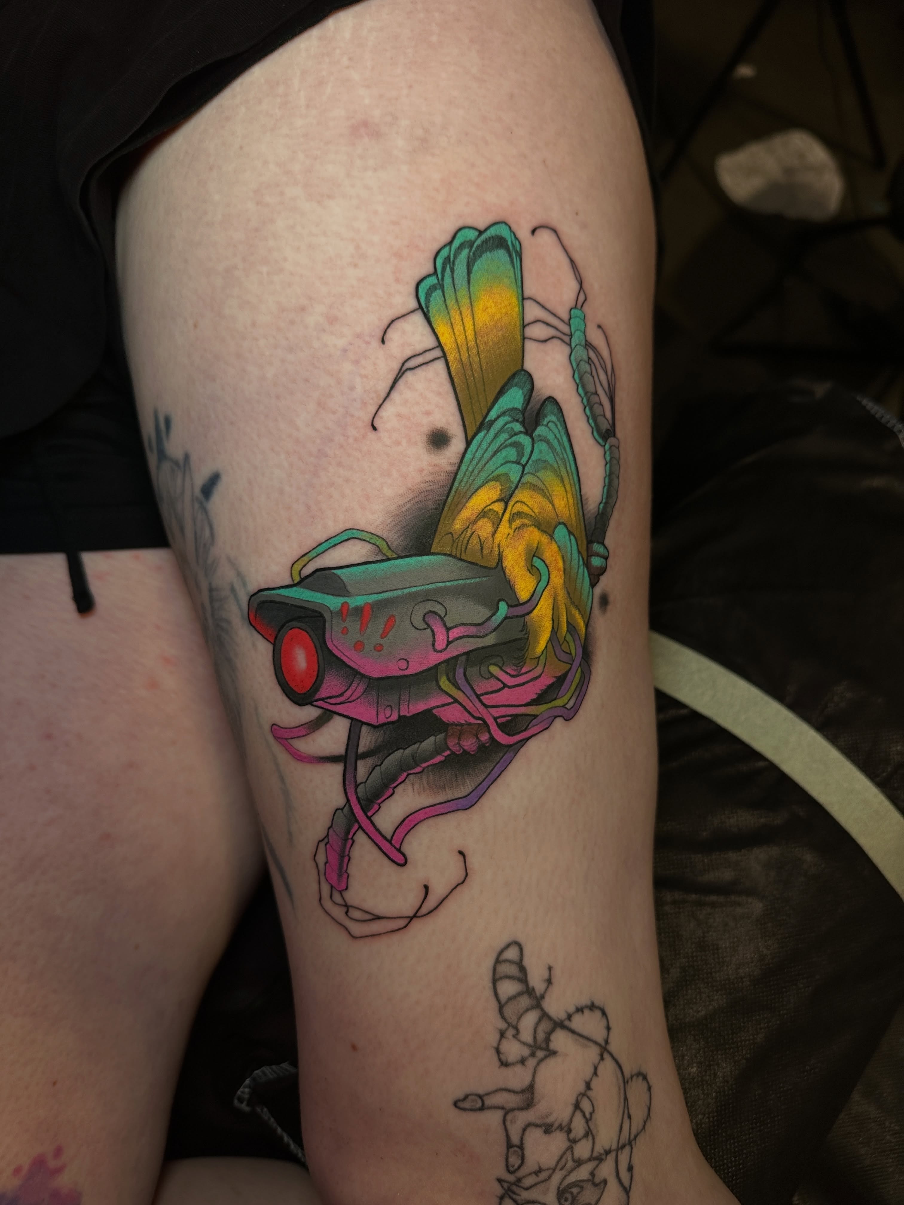 Cyborg insect new school tattoo on the thigh by Skylar Mangrum
