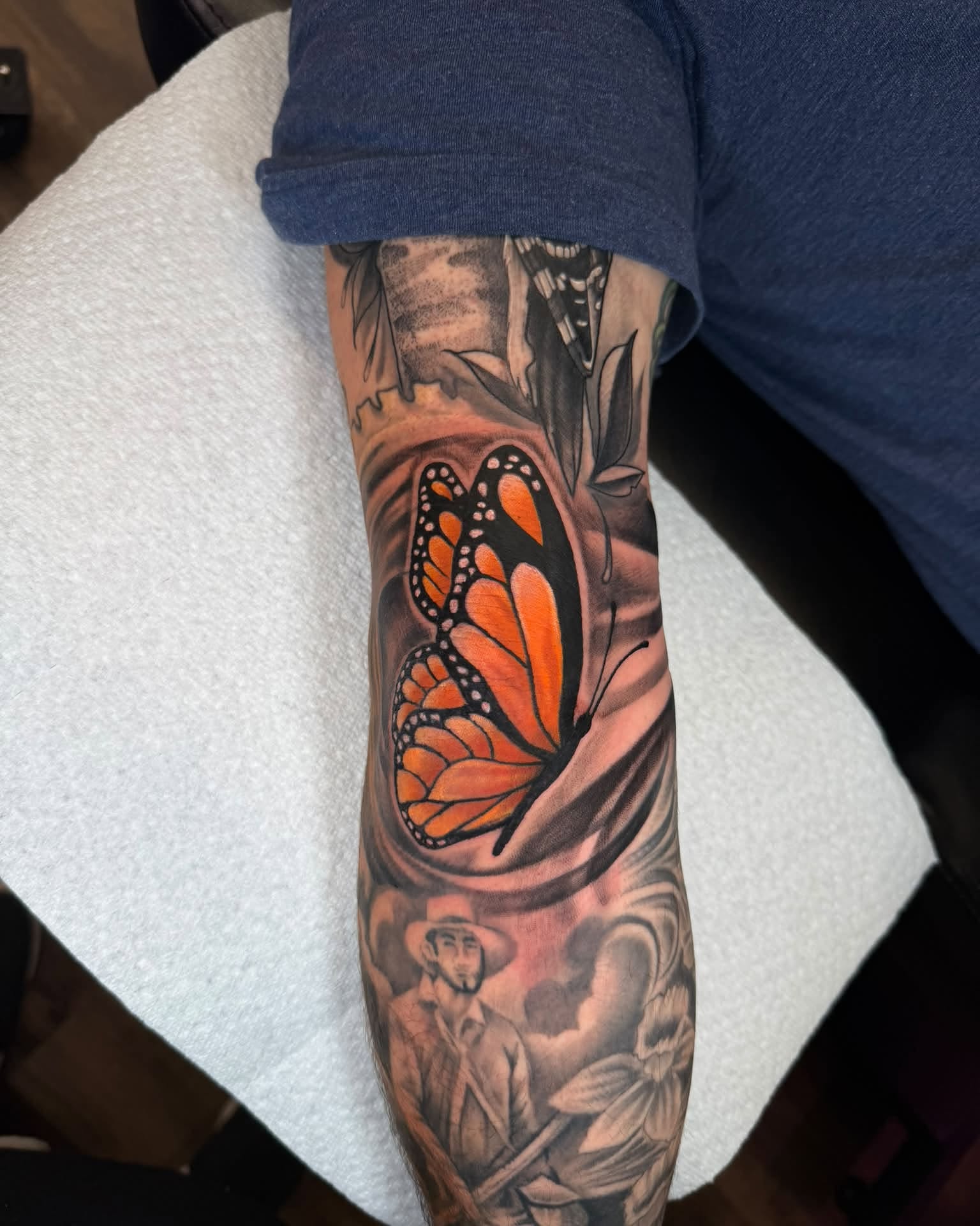 Monarch butterfly realism tattoo on the forearm by Chad Meado