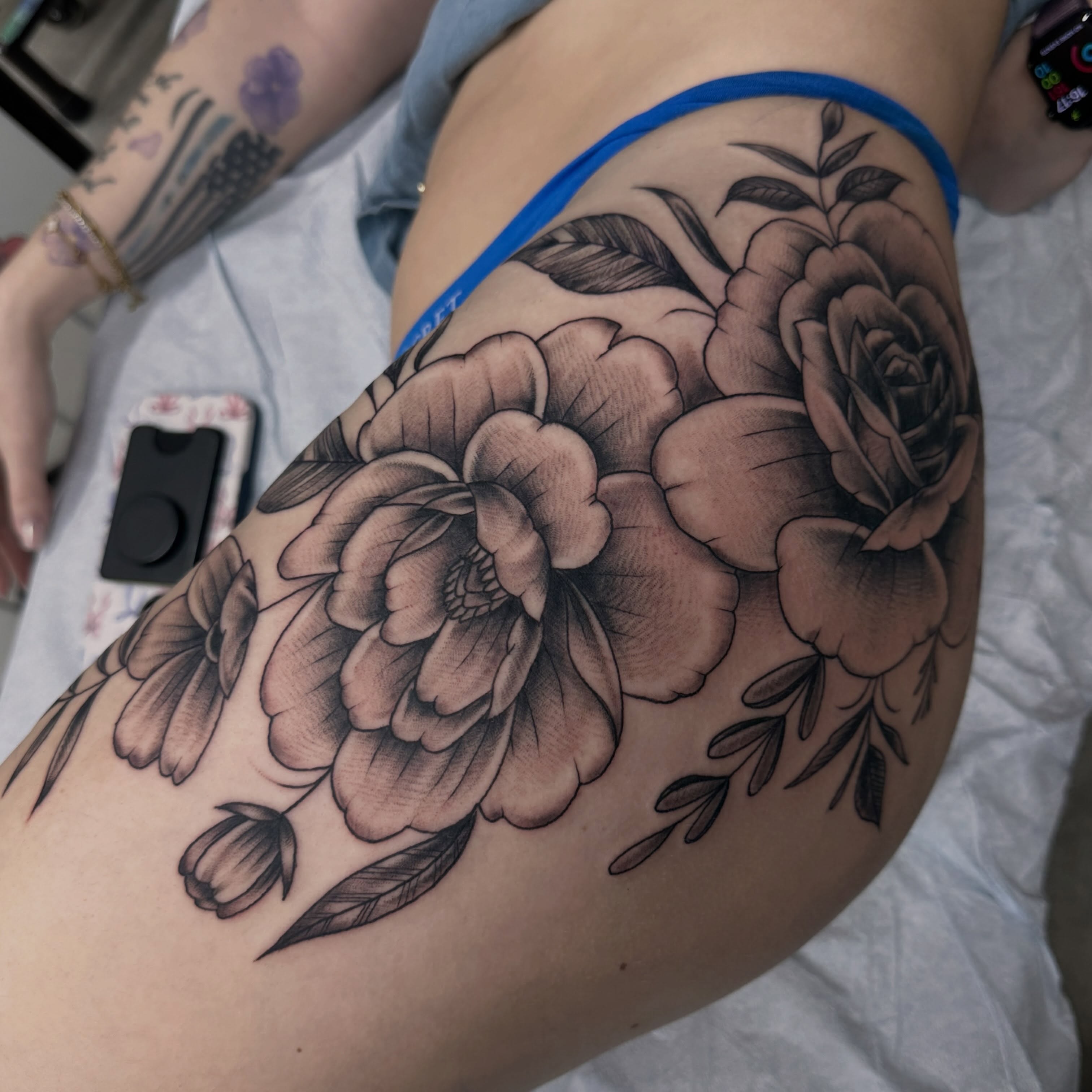 Peony flowers black and grey tattoo on the thigh by Fil Ponte
