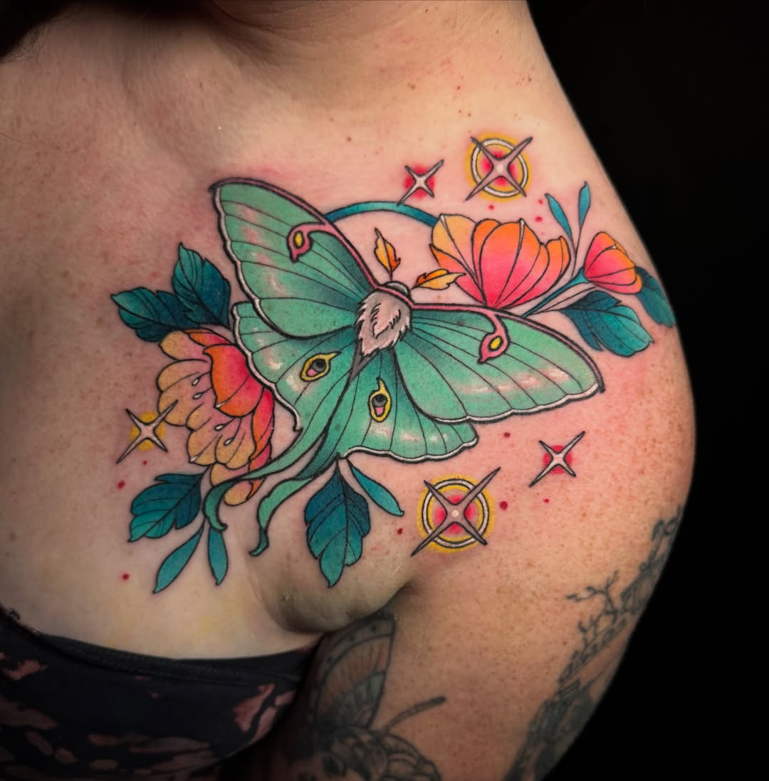 Luna moth and flowers new school tattoo on the shoulder by Dee Florian