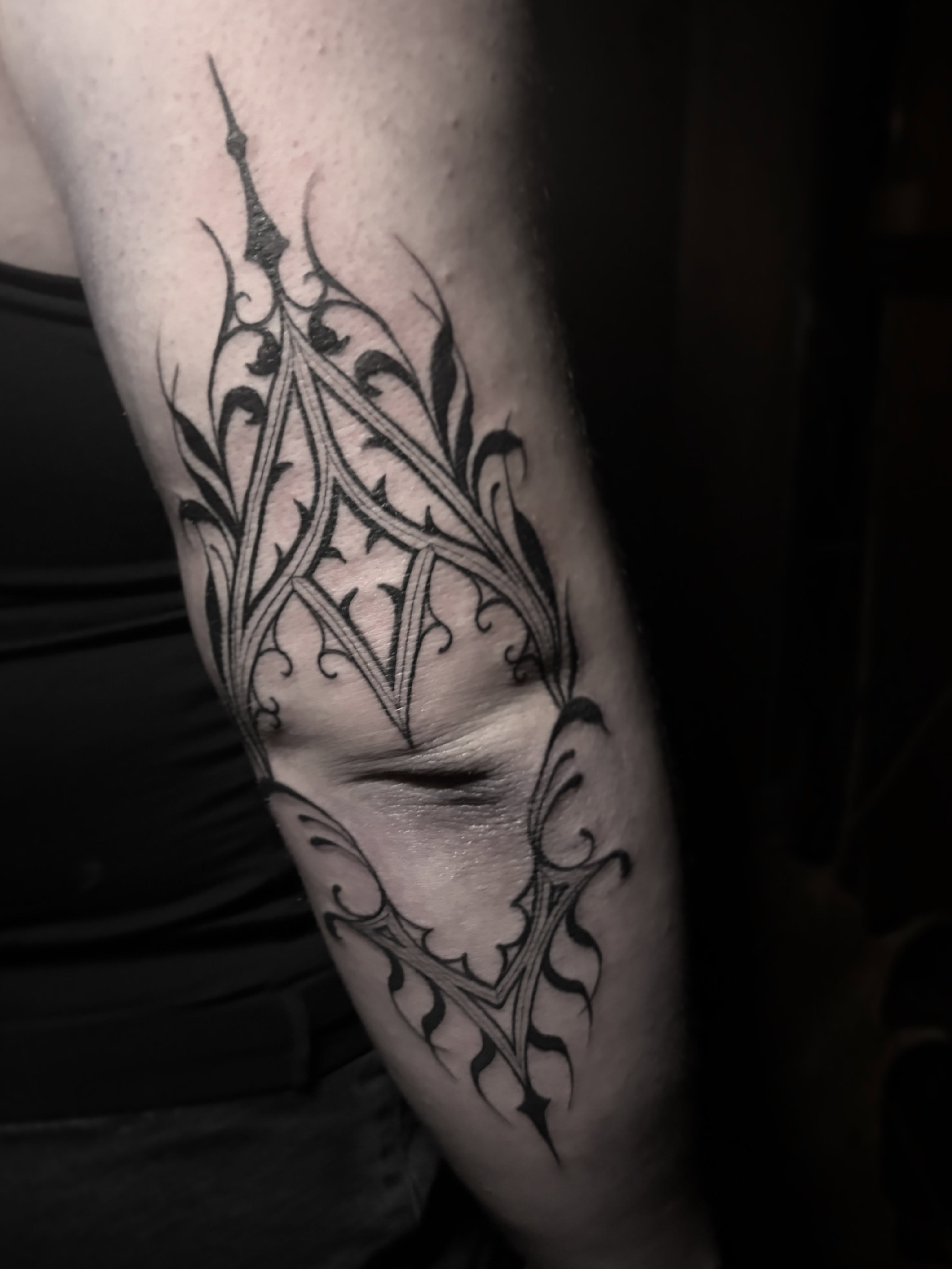 Gothic arch tribal tattoo on the forearm by Cassandra Colleen