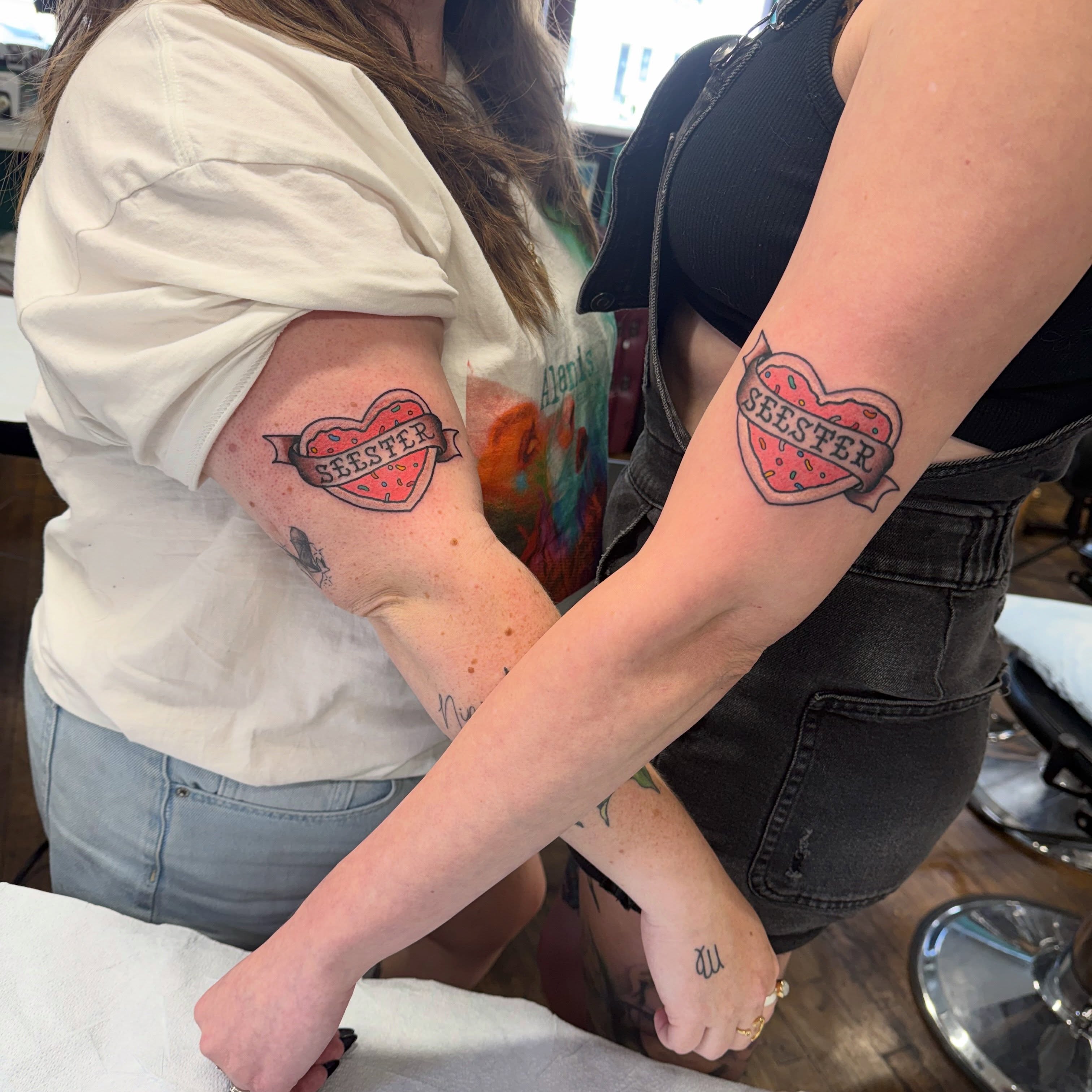 Heart with 'SELESTER' American traditional tattoo on the forearm by Aaron ulfstam