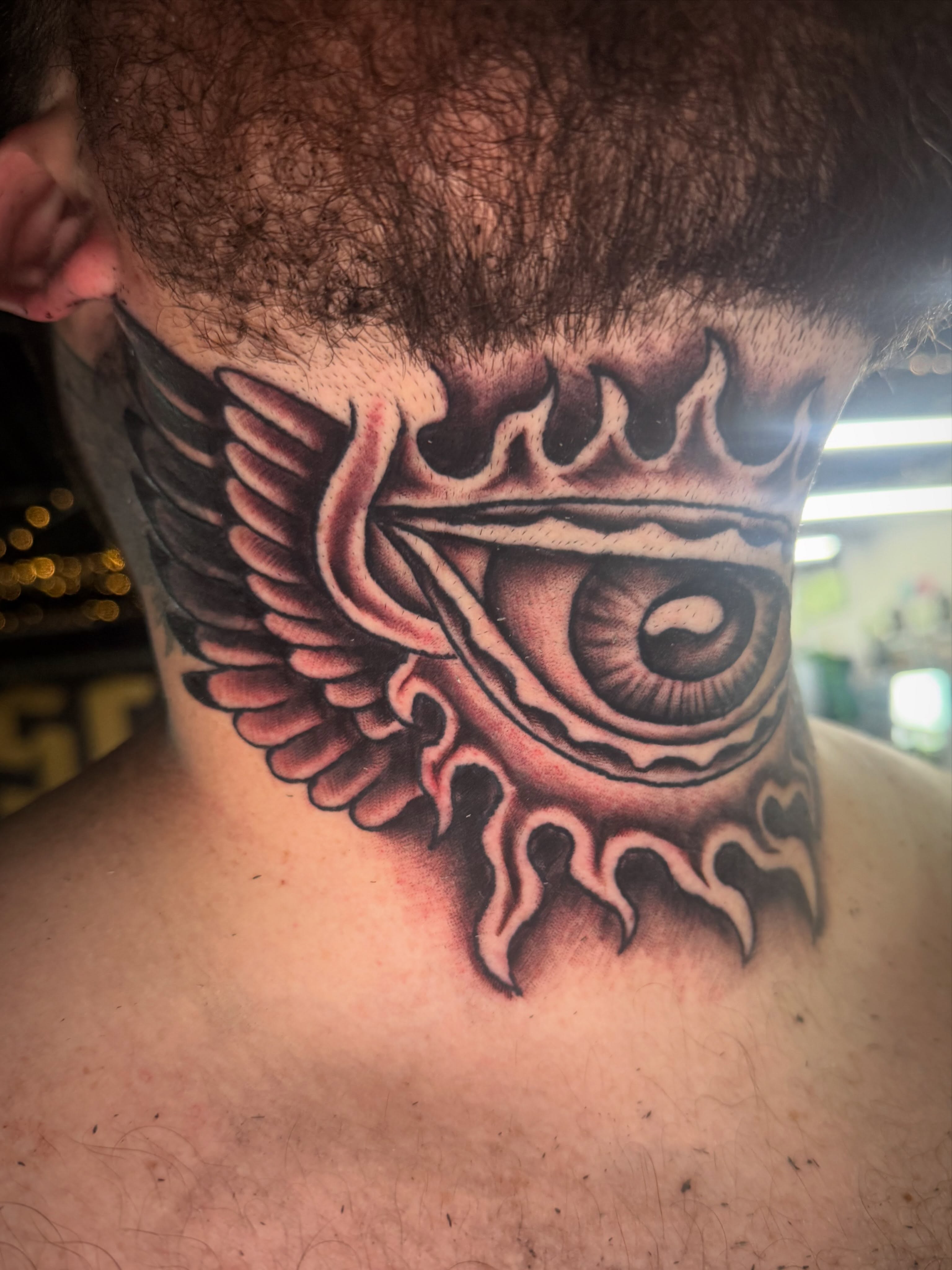 Eye with wings realism tattoo on the neck by Jake Horstman, Dayton, Ohio
