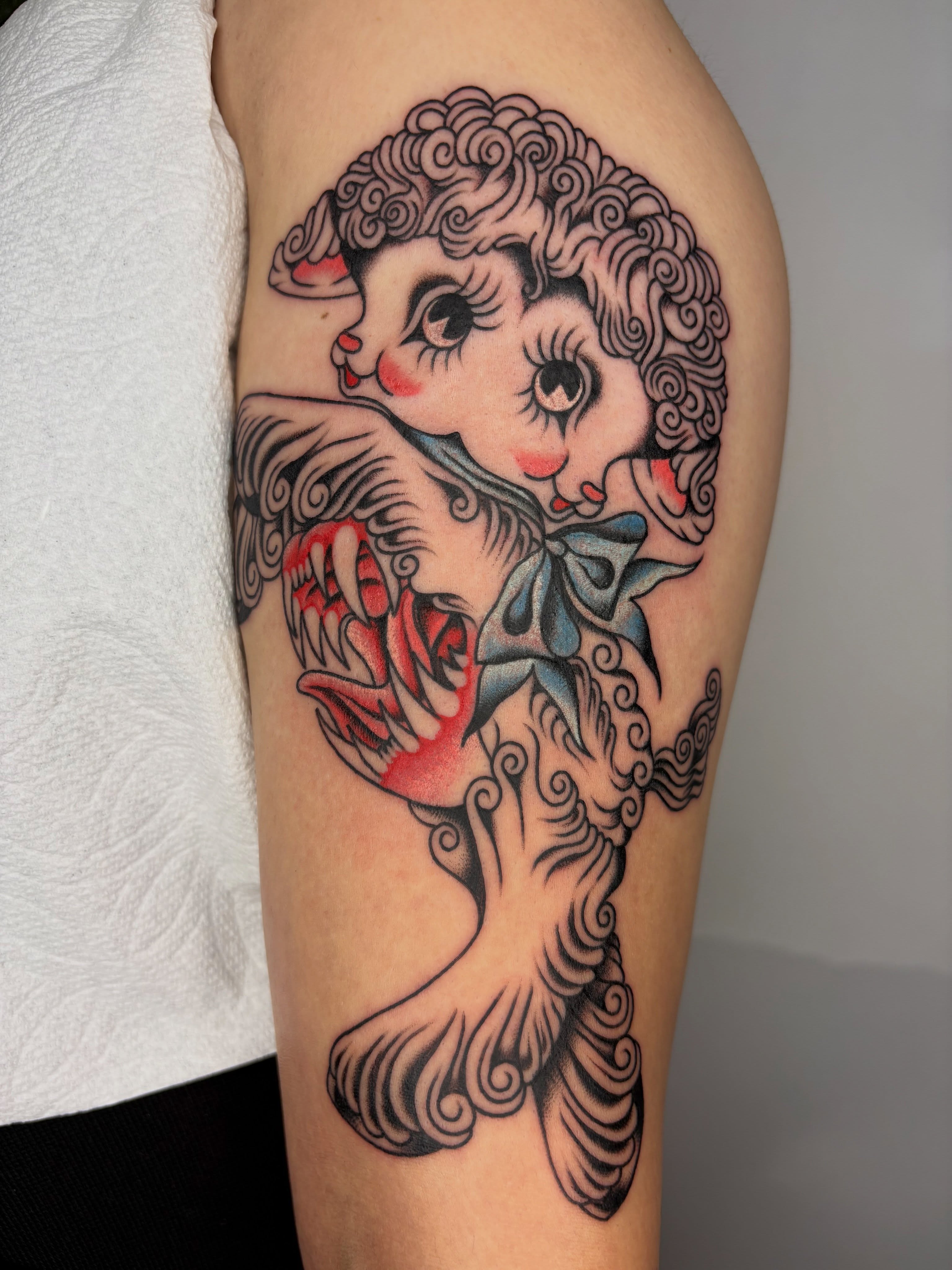 Doll American traditional tattoo on the forearm by Nori