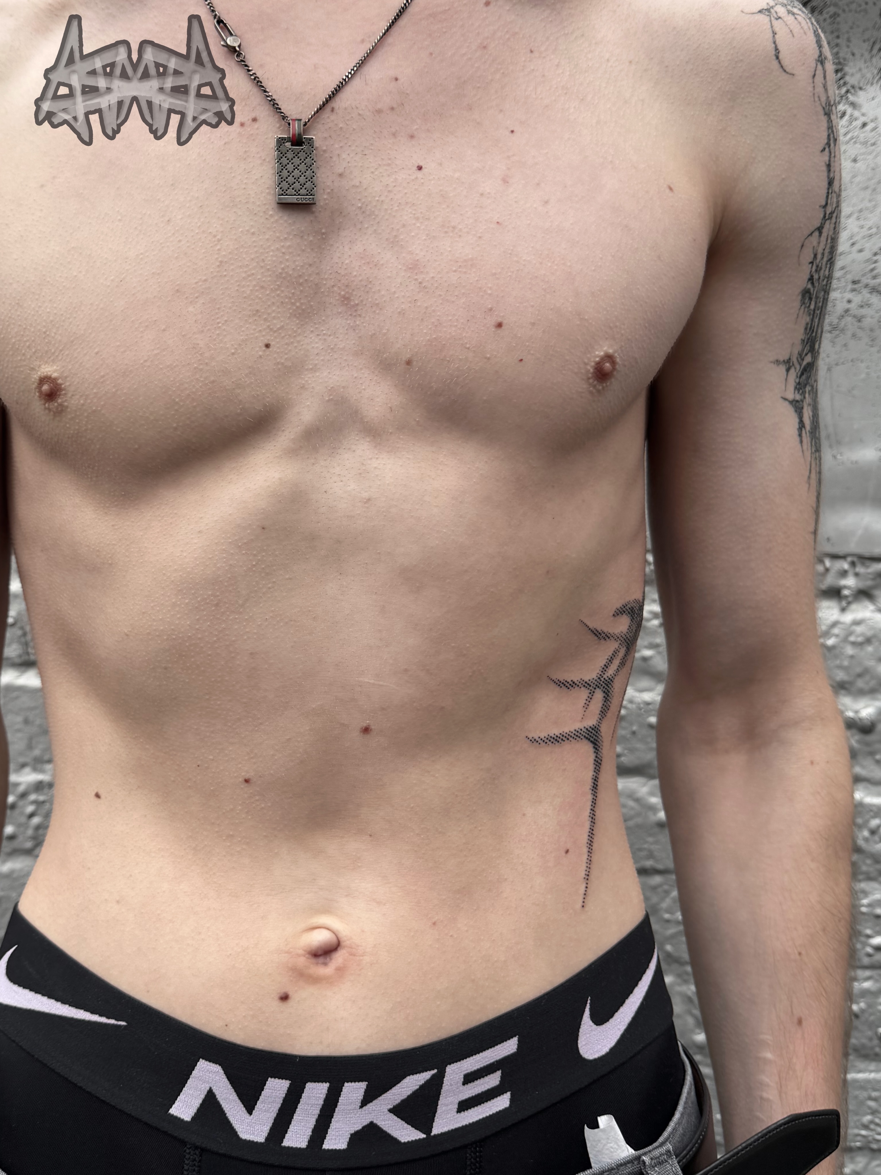 Cross black and grey tattoo on the chest by Haza