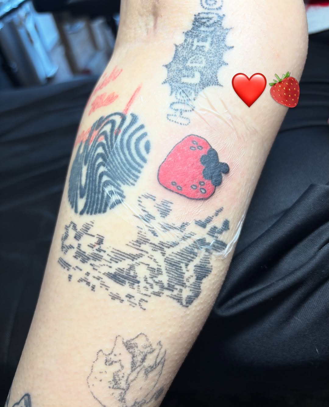 Strawberry dotwork tattoo on the forearm by riley