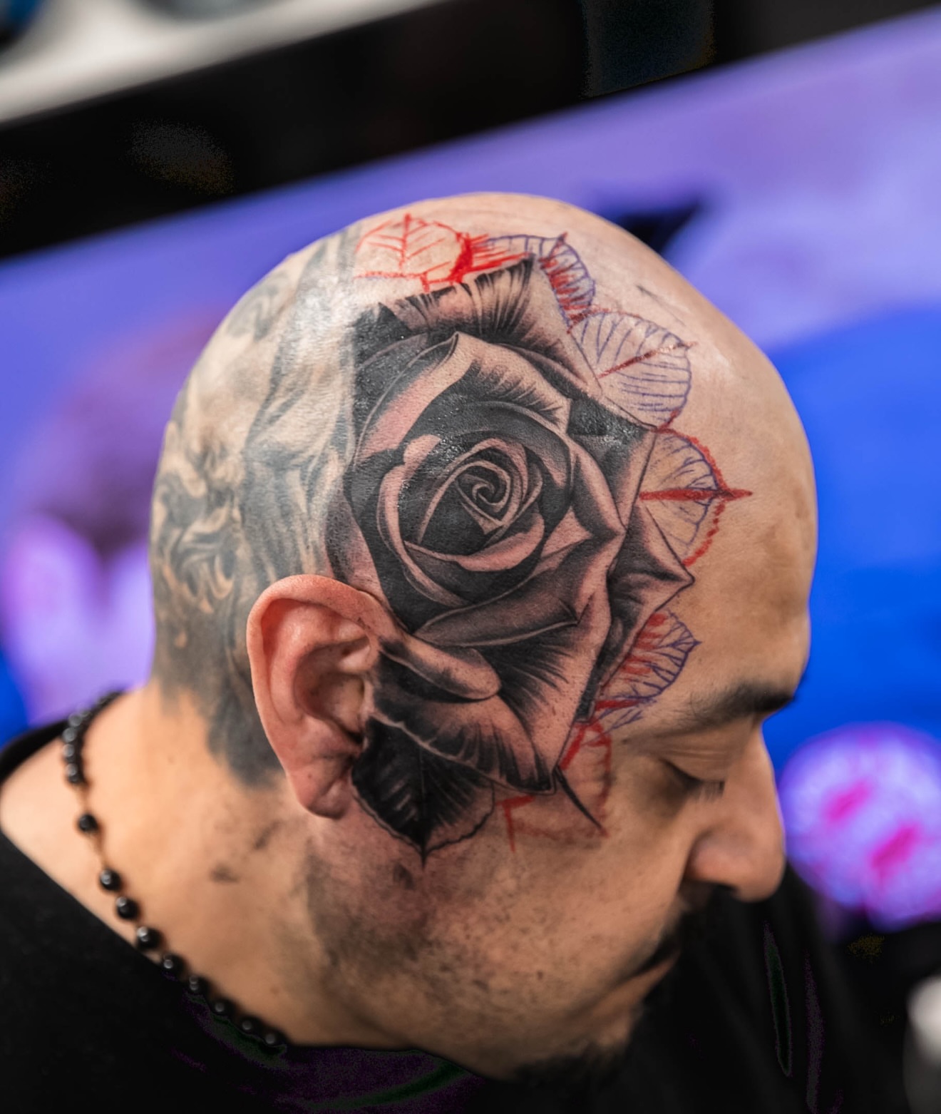 Rose realism tattoo on the head by Dillinger, Ventura, California
