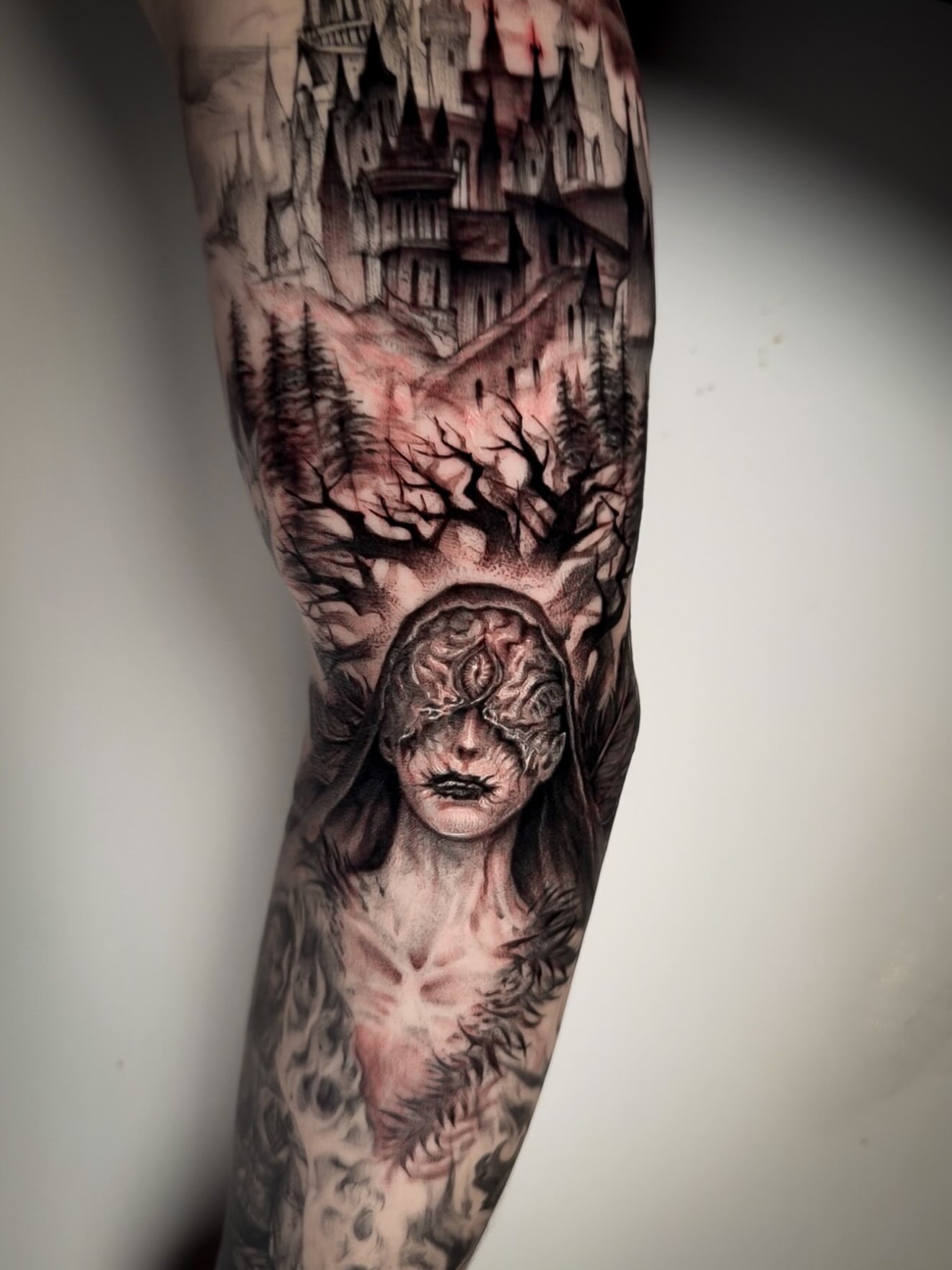 Castle and forest realism tattoo on the forearm by Chris Jang