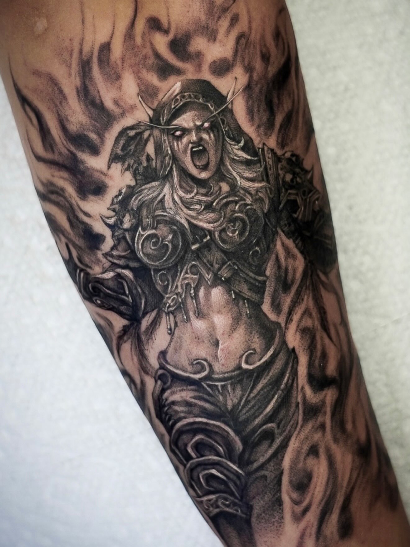 Warrior black and grey tattoo on the forearm by Chris Jang