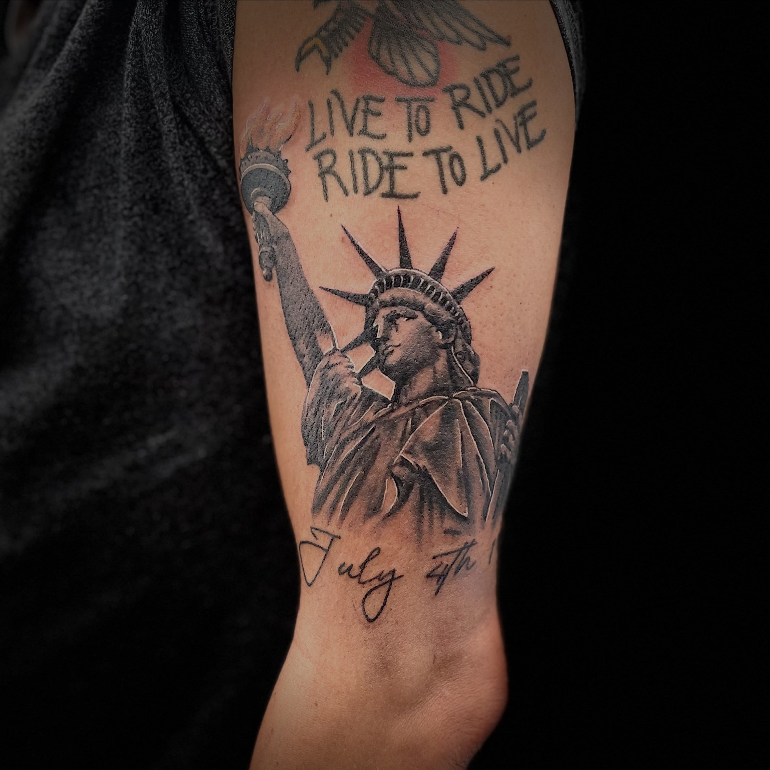 Statue of liberty realism tattoo on the forearm by Tyler Howard