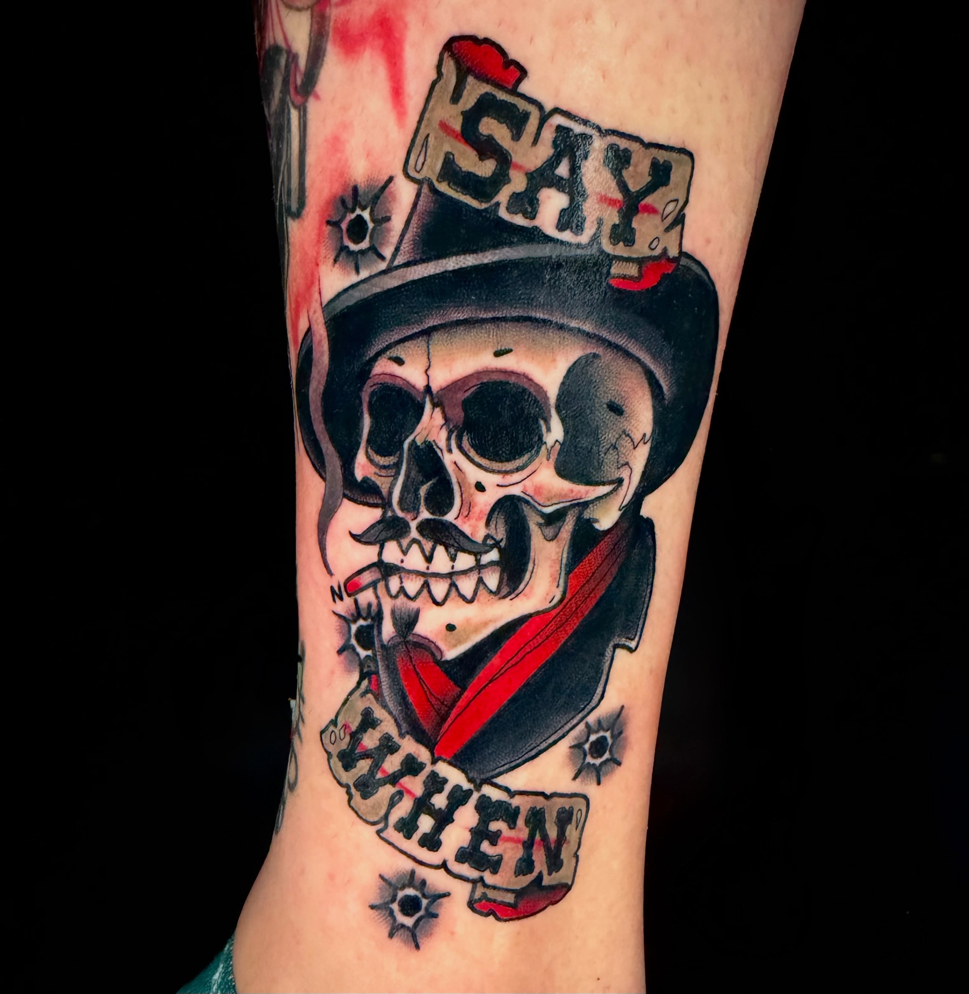 Skull wearing top hat American traditional tattoo on the forearm by Trenton Helms