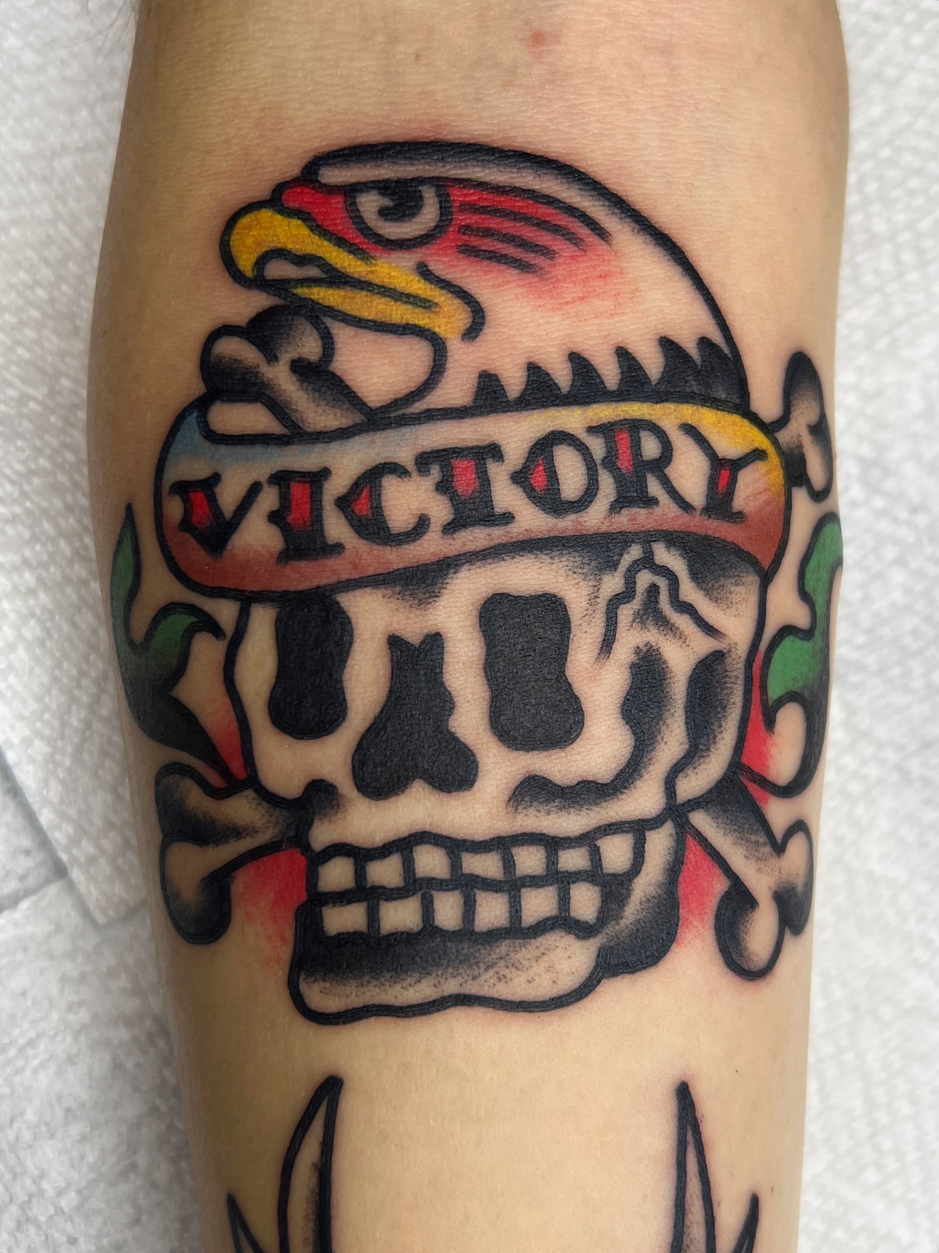 Skull and eagle American traditional tattoo on the forearm by Tattoo