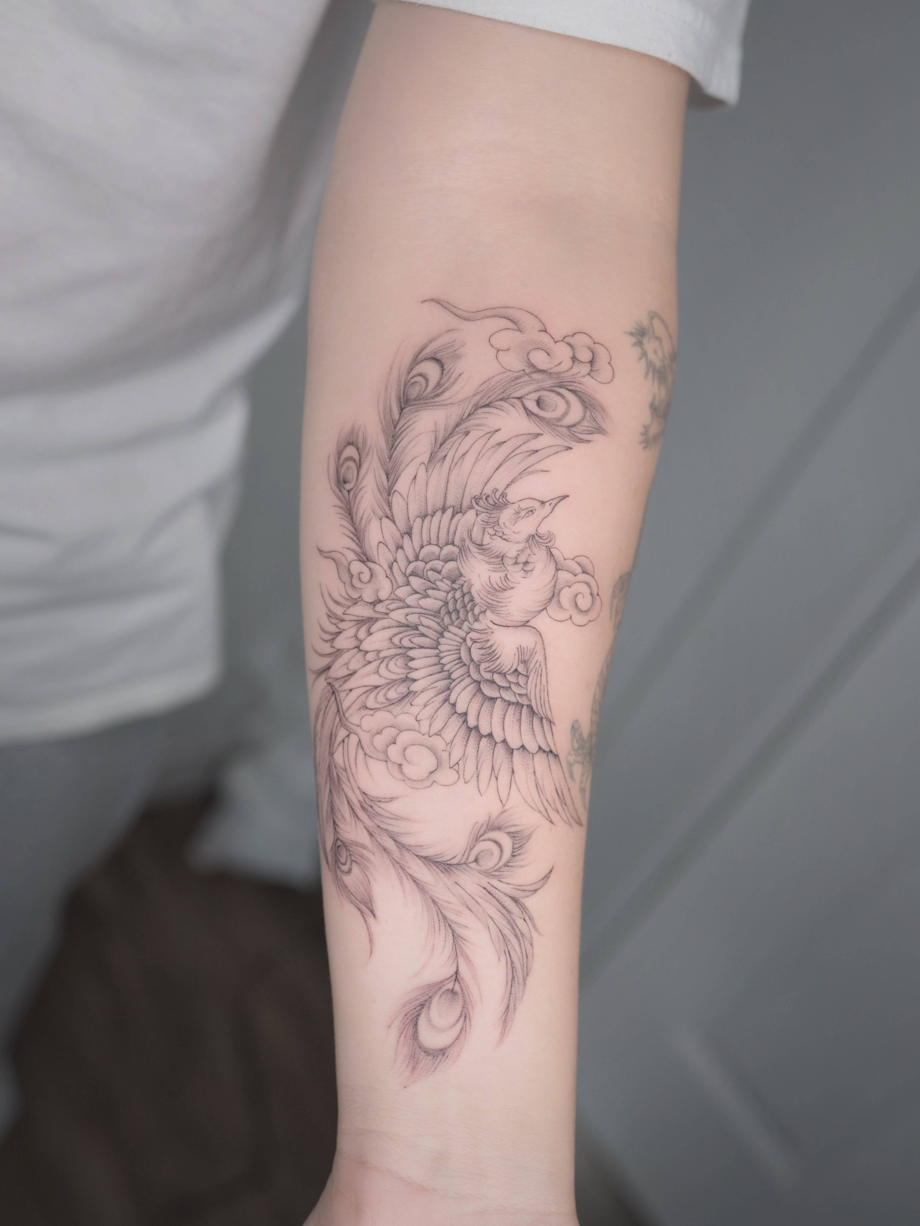 Bird and flower black and grey tattoo on the forearm by Seattle tattoo artist-Mia