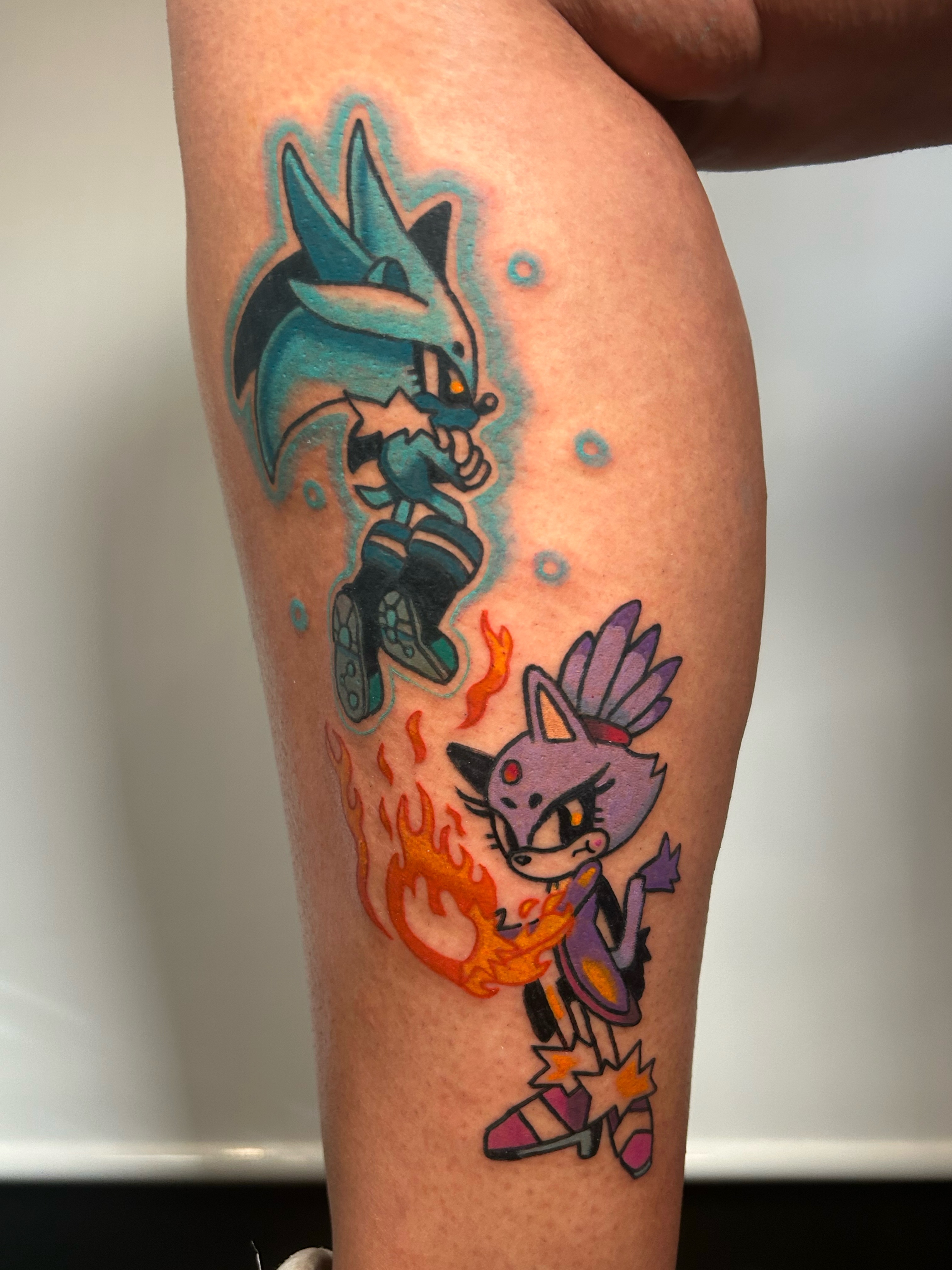 Sonic and amy anime tattoo on the forearm by Ollie