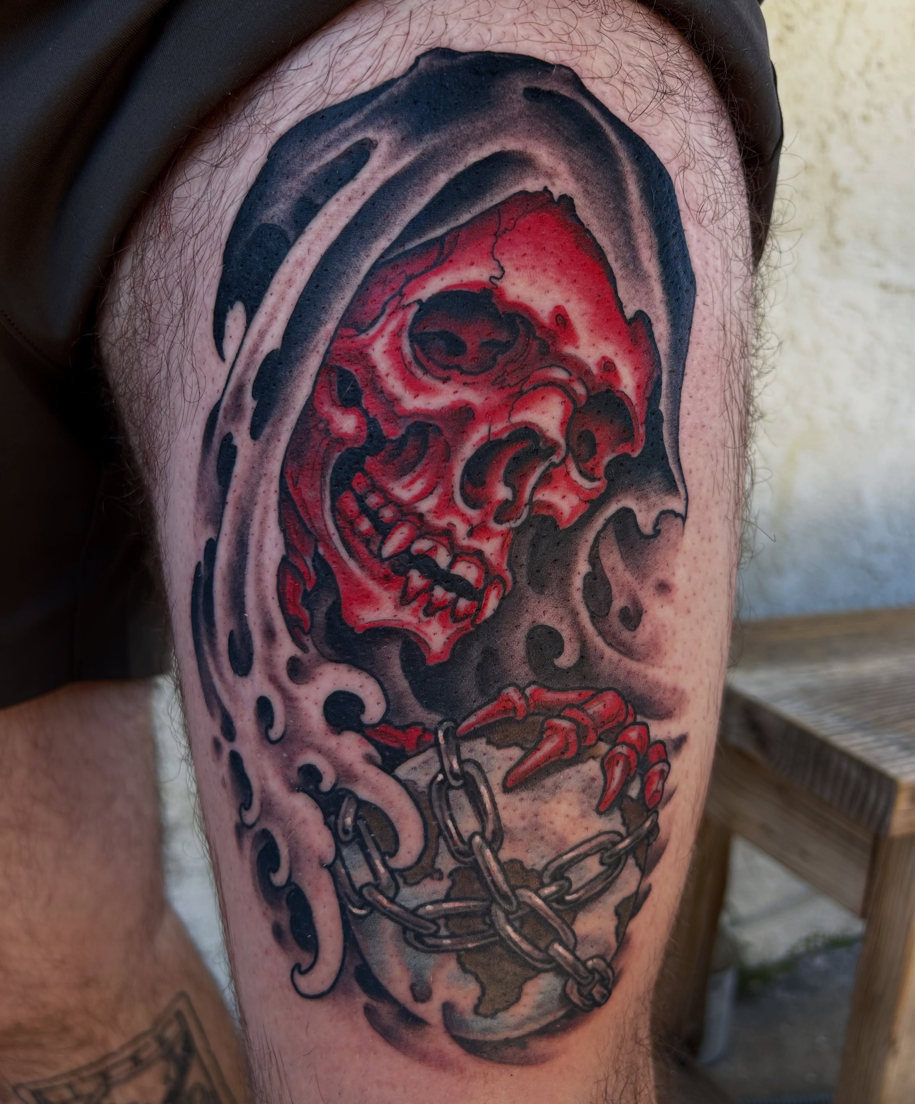Skull and chain dark realism tattoo on the thigh by Justin Weatherholtz, New York, New York