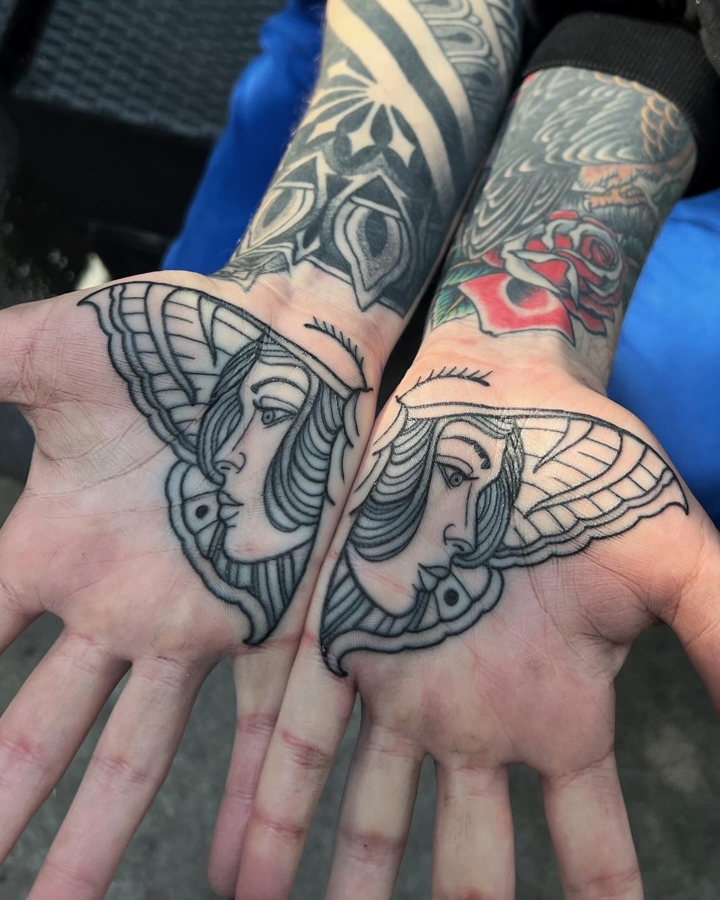 Winged woman American traditional tattoo on the hand by Mark Walker