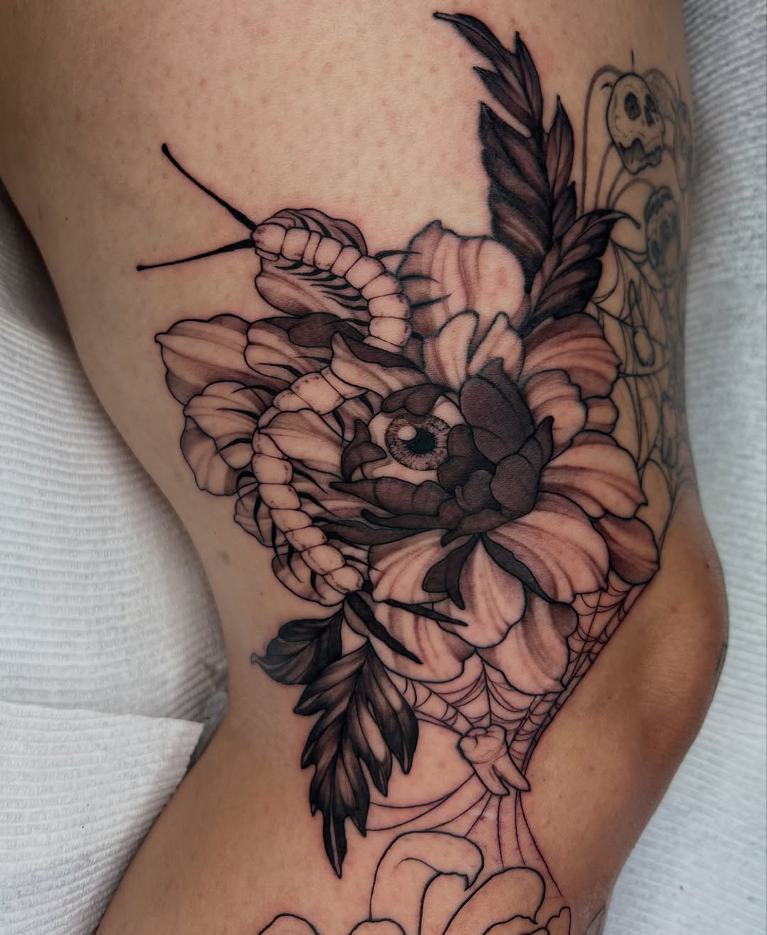 Peony flower black and grey tattoo on the forearm by Severin Black