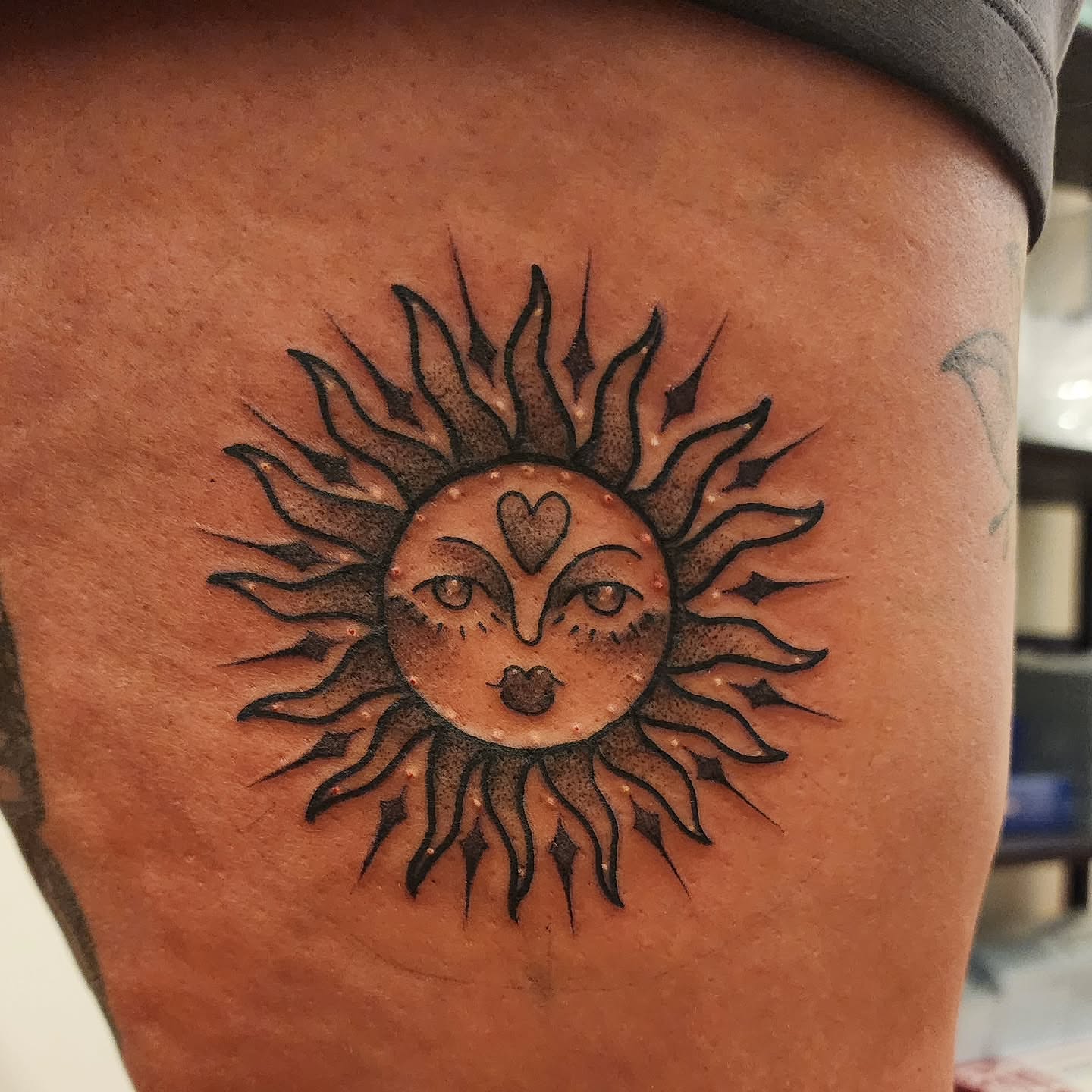 Sun face dotwork tattoo on the thigh by mikayla