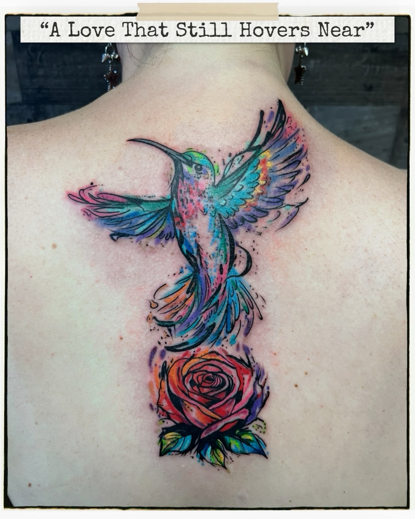 Hummingbird and rose watercolor tattoo on the back by Hugh Anthony Washington, Hattiesburg, Mississippi