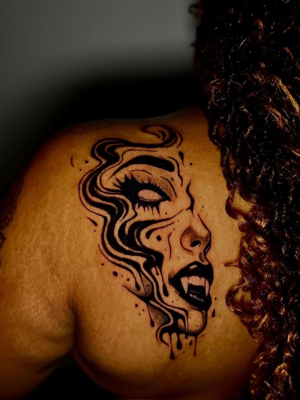 Woman's face realism tattoo on the shoulder by Tattoos by Fesik LLC