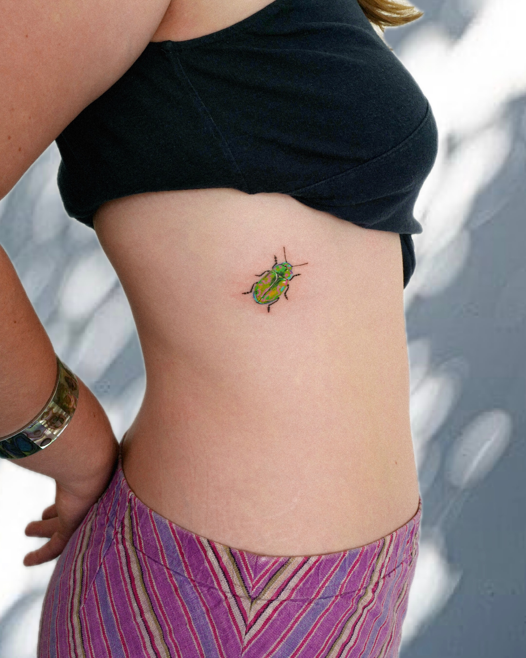 Beetle realism tattoo on the torso by dahye lee