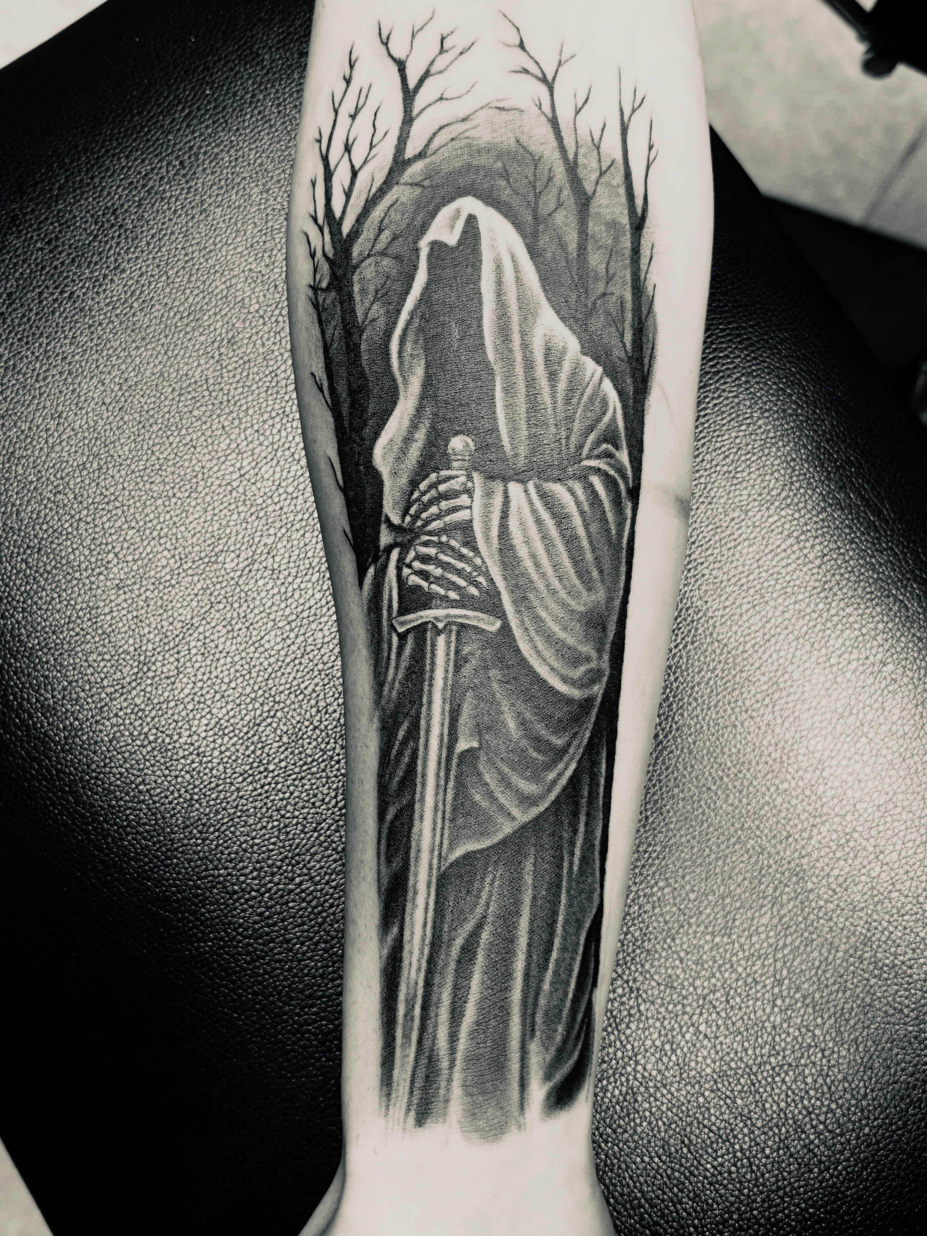 Grim reaper realism tattoo on the forearm by Sean Rakos, Austin, Texas