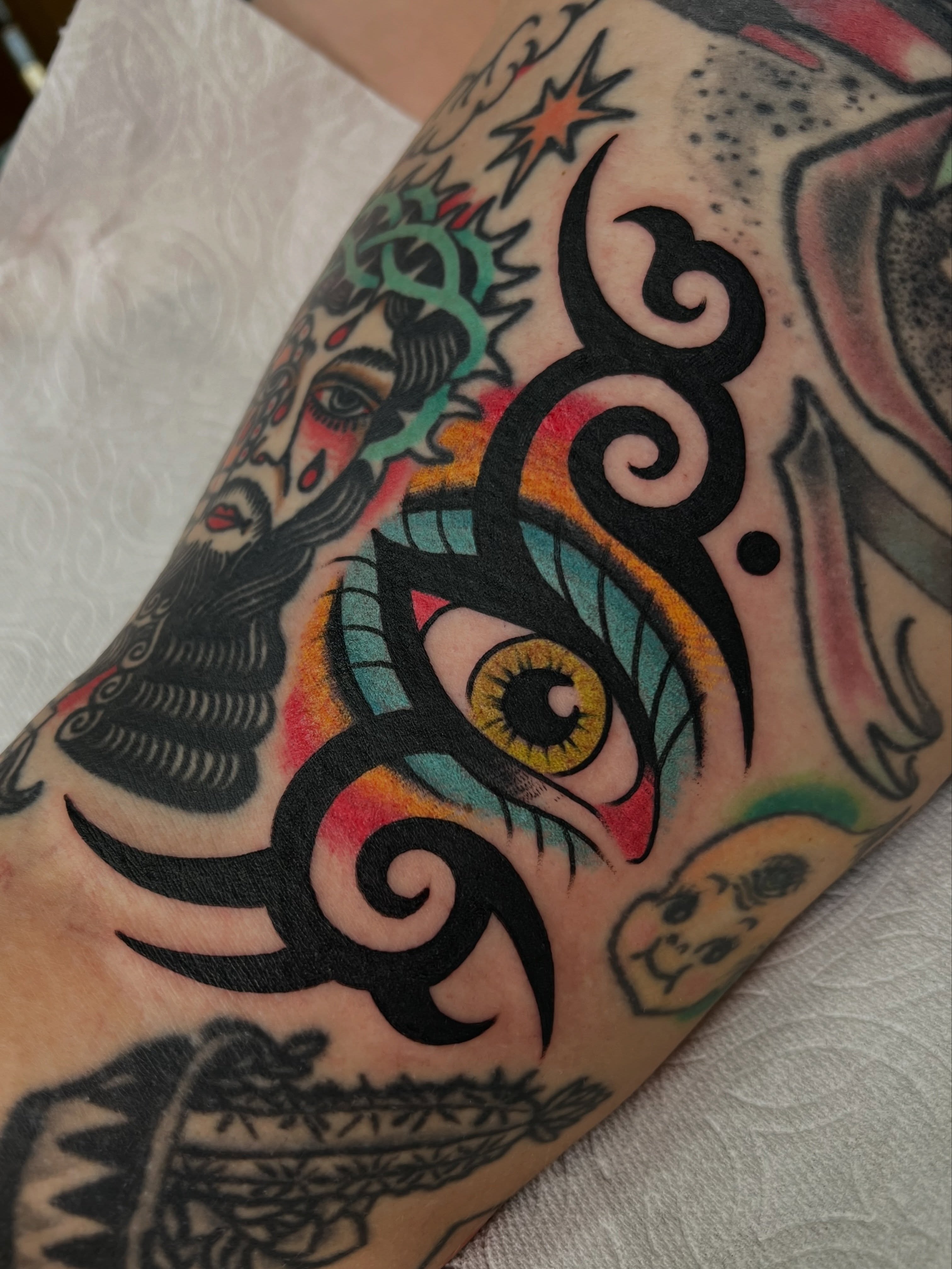 Eye with tribal swirls American traditional tattoo on the forearm by ⛓️ L̷i̷n̷n̷e̷a̷⛓️, Las Vegas, Nevada