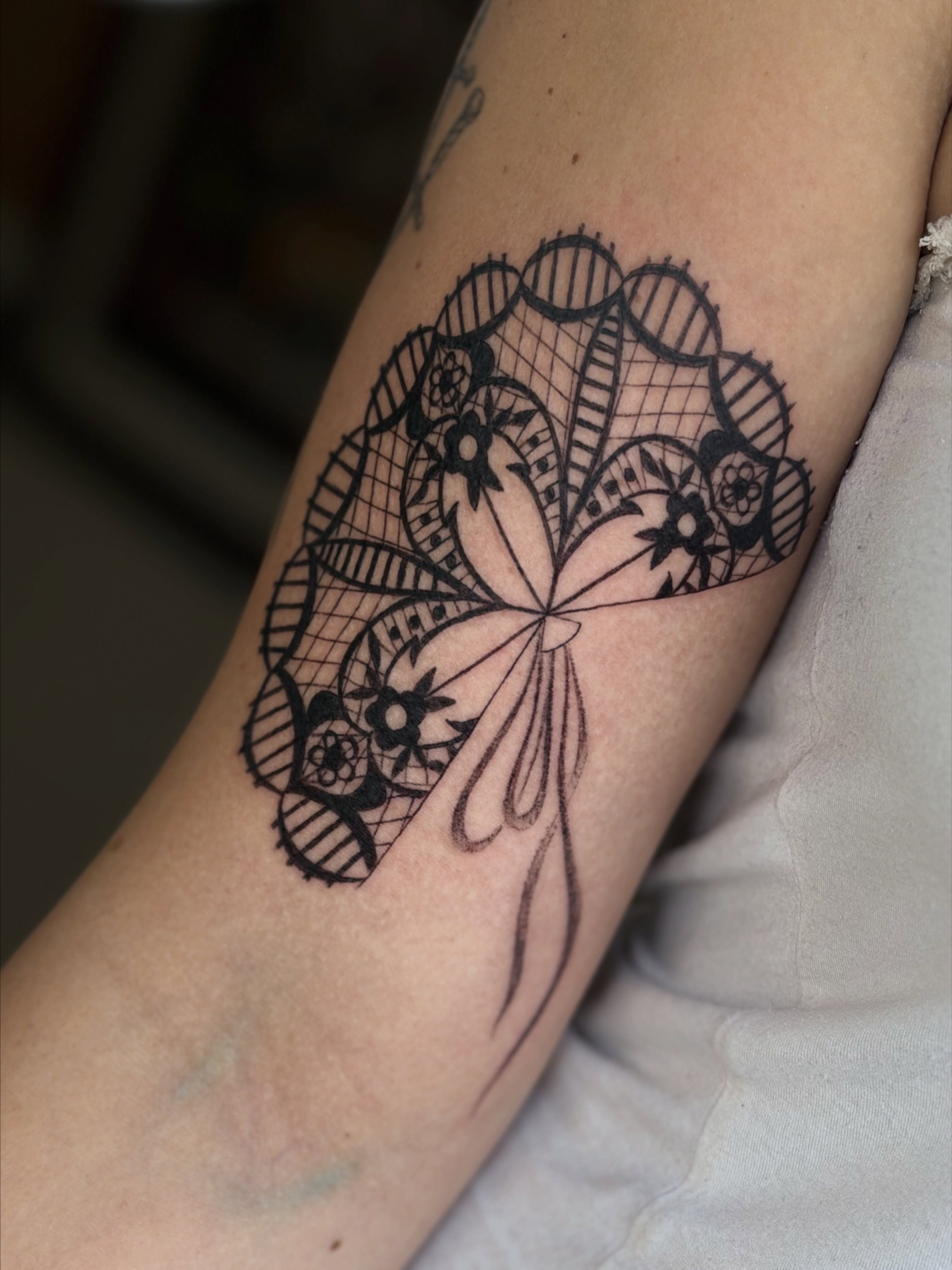 Lace pattern black and grey tattoo on the forearm by Maddie Blosser, Portland, Oregon