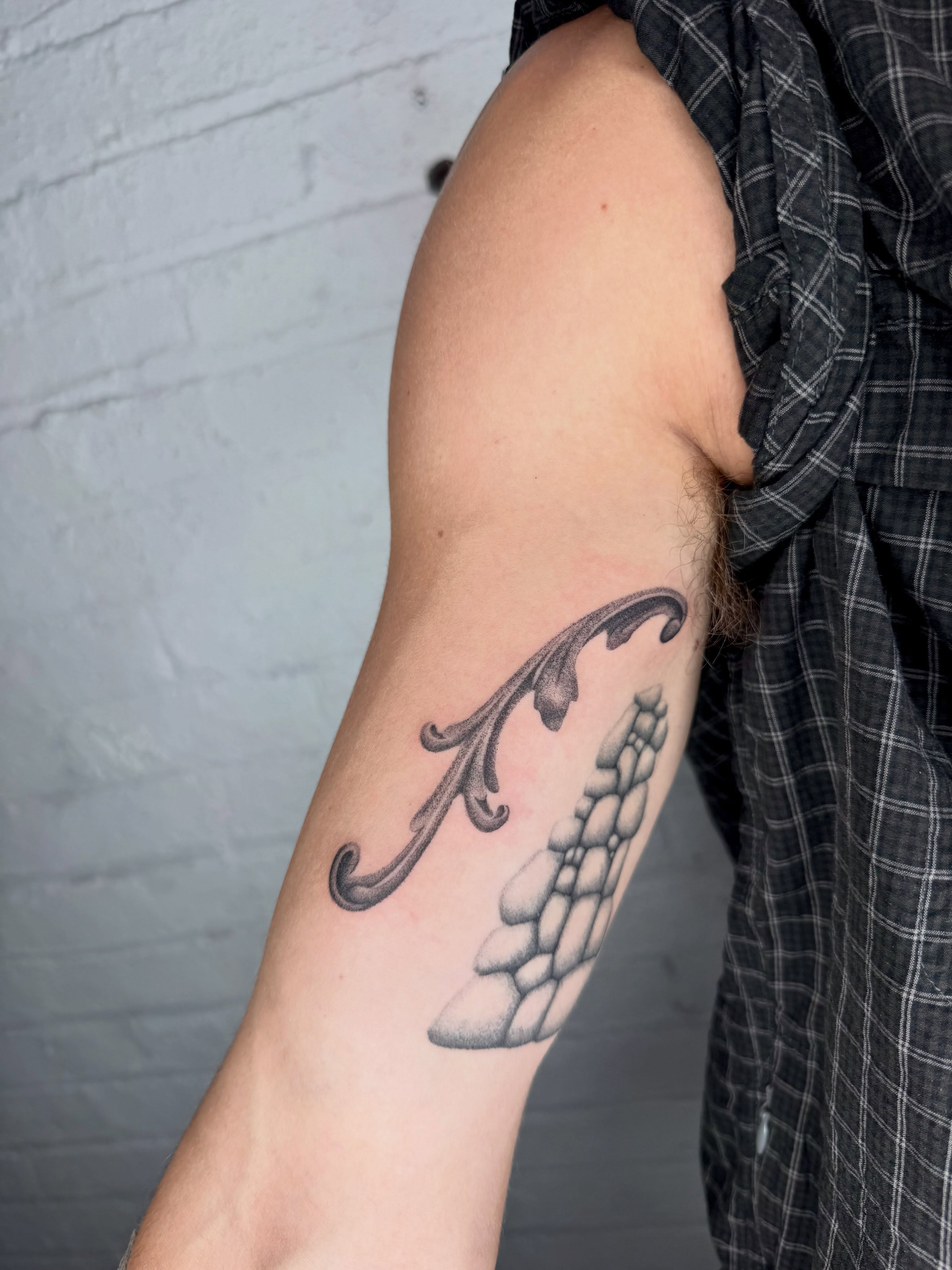 Wing black and grey tattoo on the forearm by Kenny ๐ด