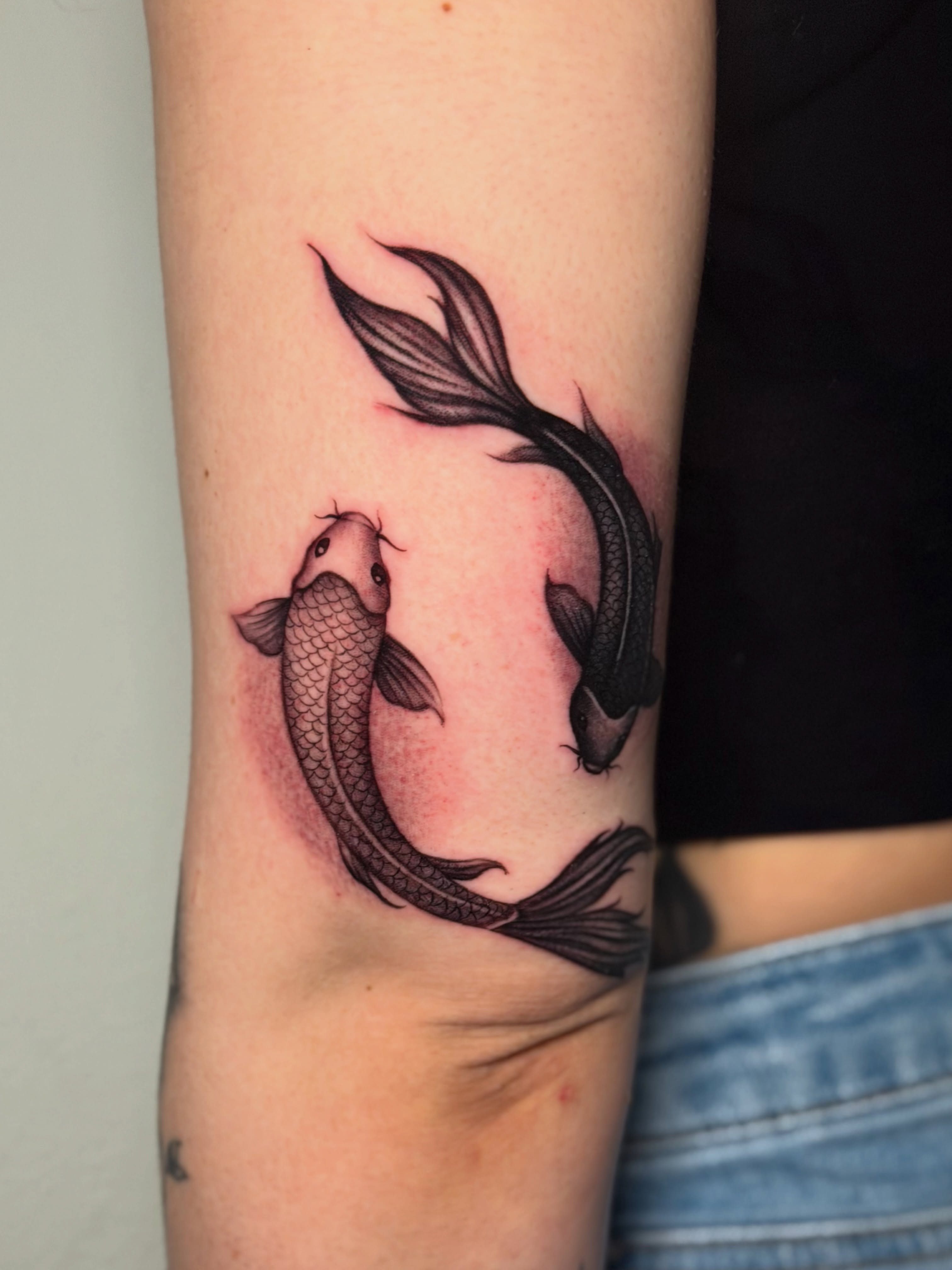 Koi fish black and grey tattoo on the forearm by Kiki Tattoos😈