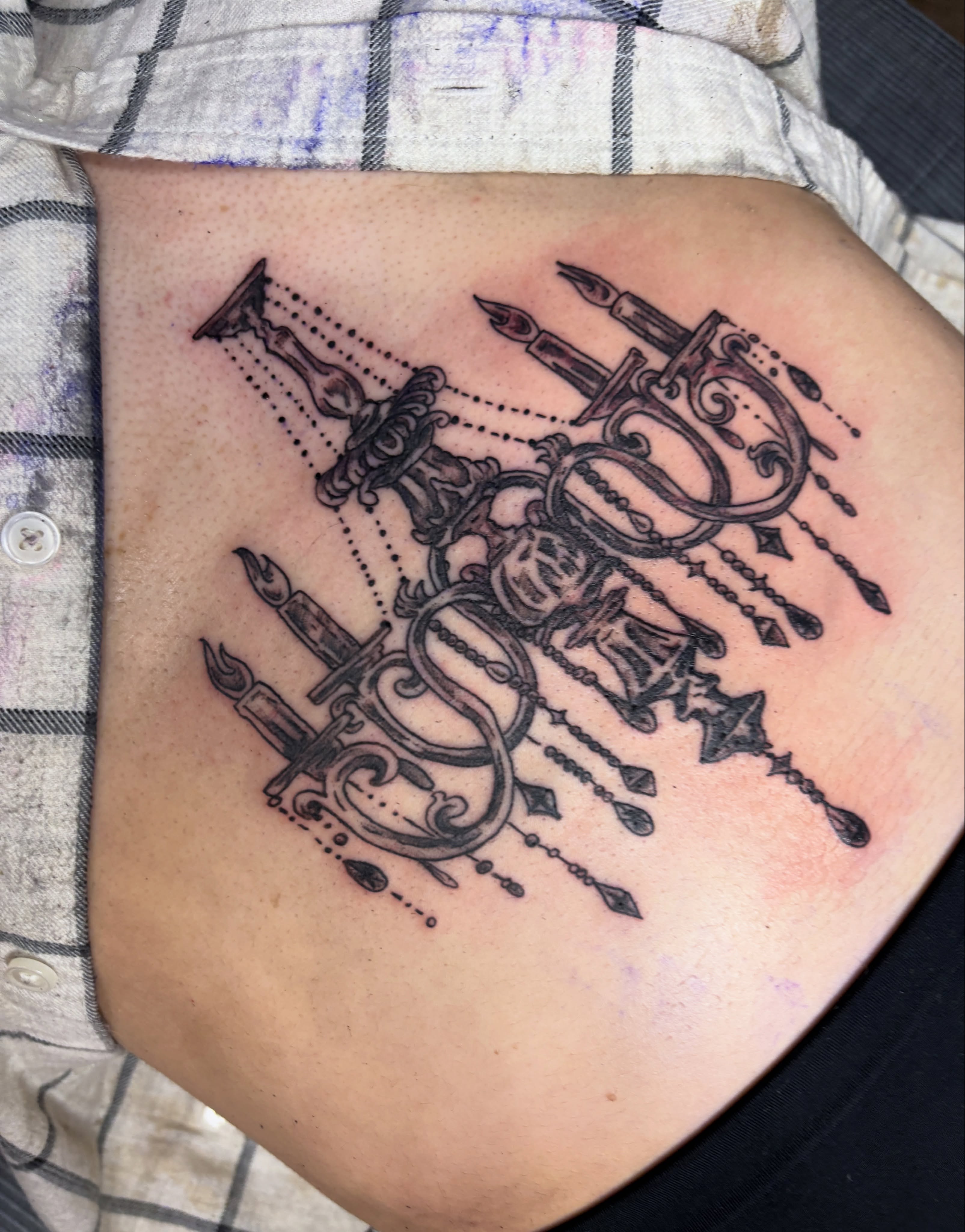 Candelabra black and grey tattoo on the ribs by Casey - Tattooer, Salem, Massachusetts