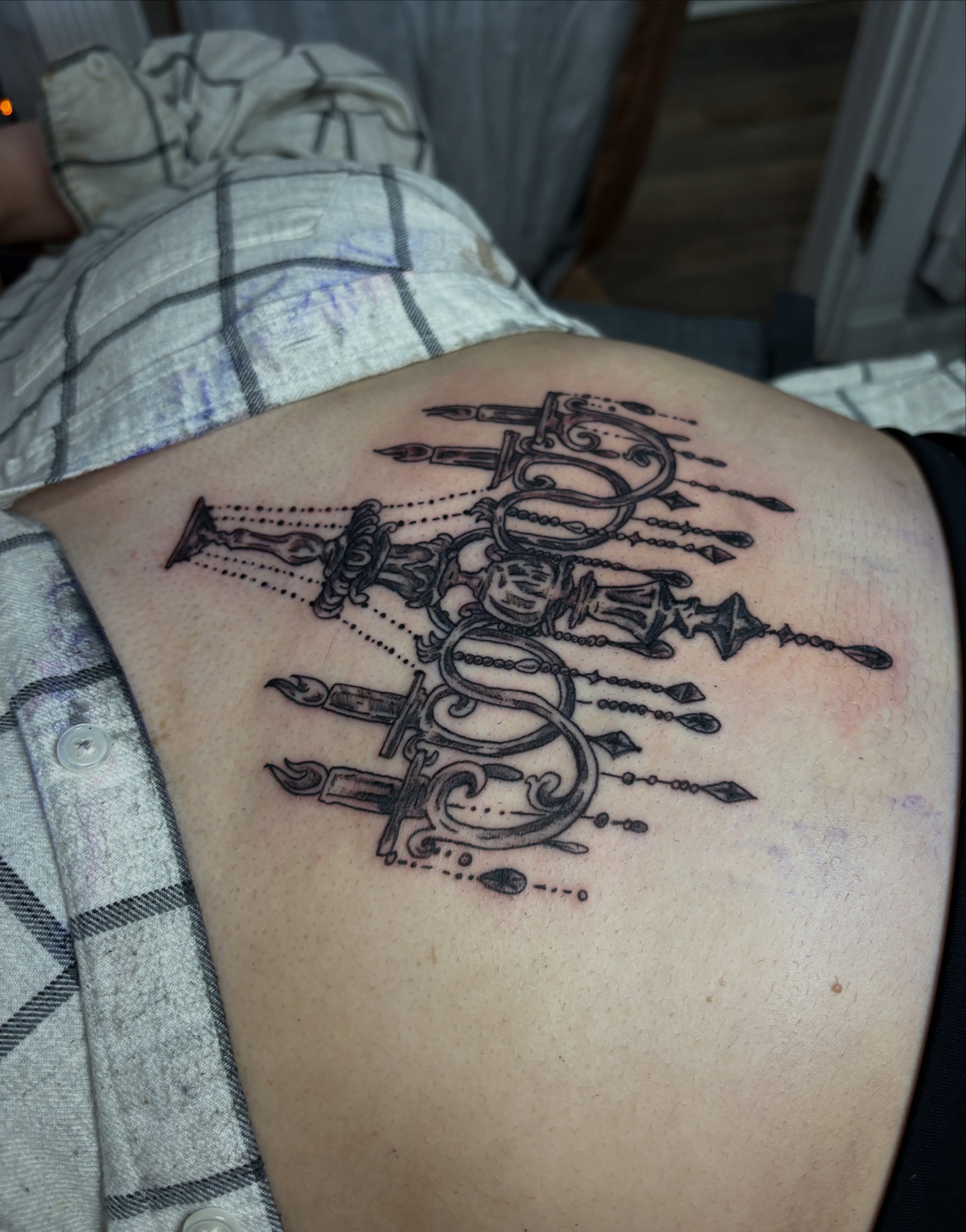 Chandelier black and grey tattoo on the back by Casey - Tattooer, Salem, Massachusetts