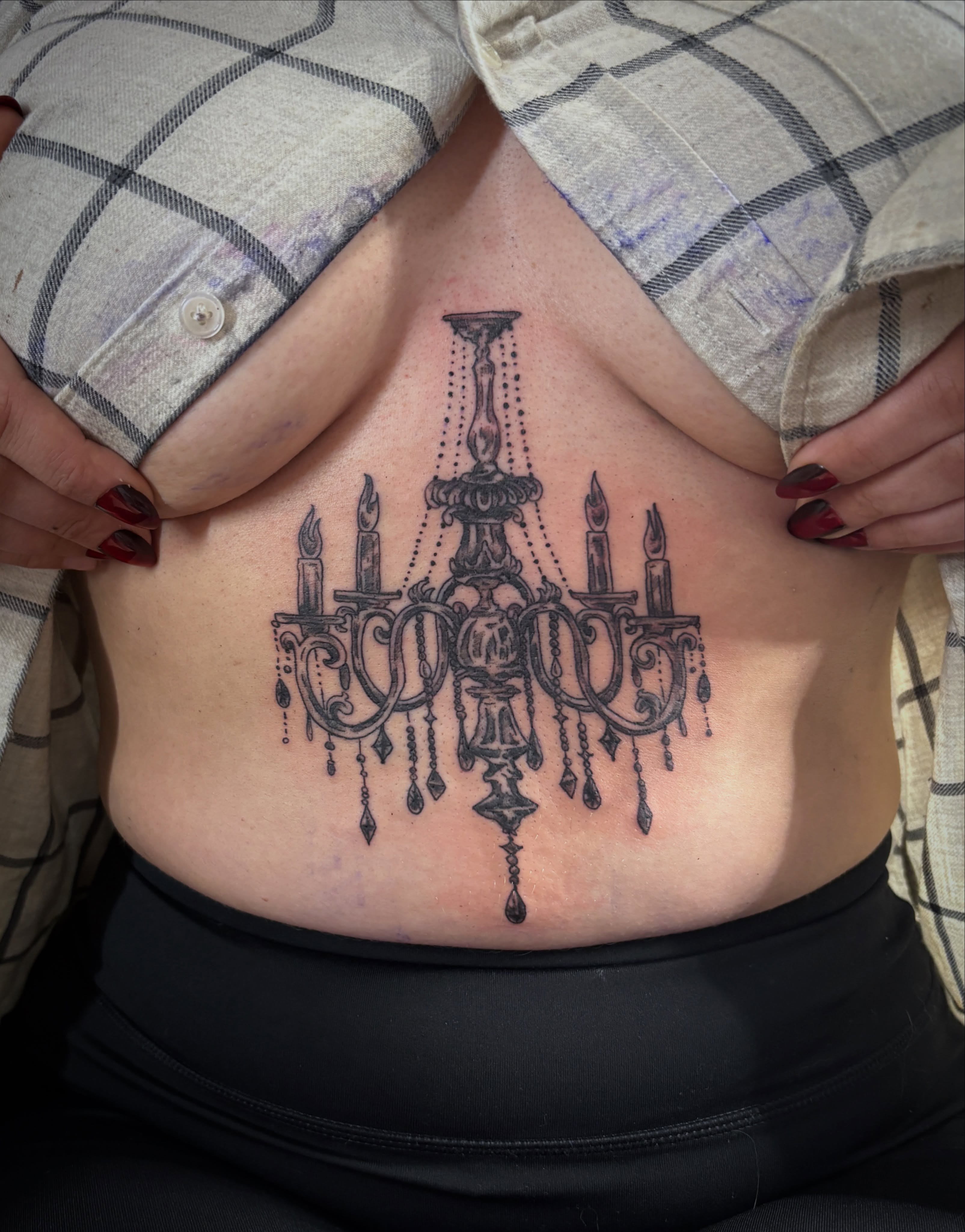 Chandelier black and grey tattoo on the ribs by Casey - Tattooer, Salem, Massachusetts