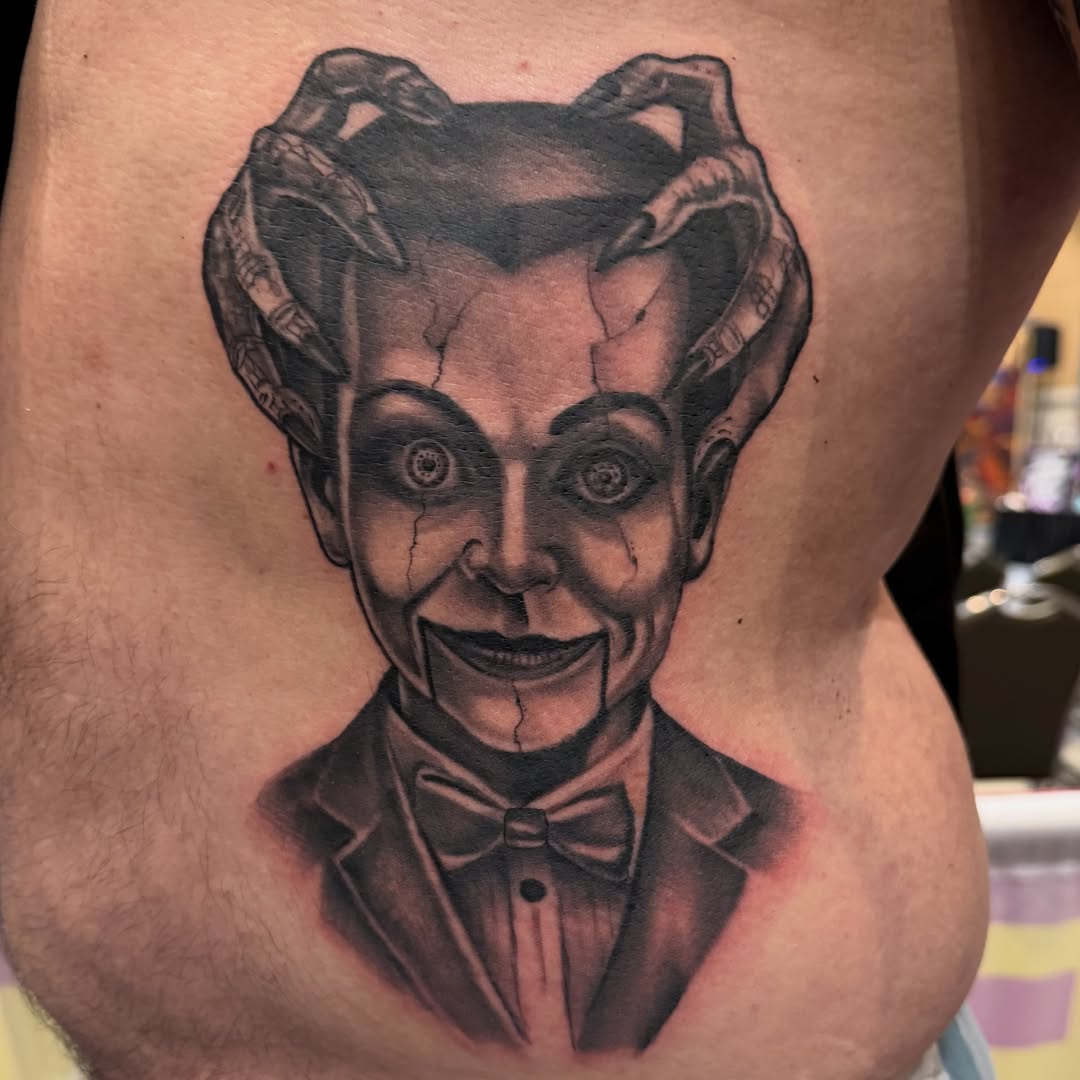 Clown realism tattoo on the thigh by Chris Smiseck