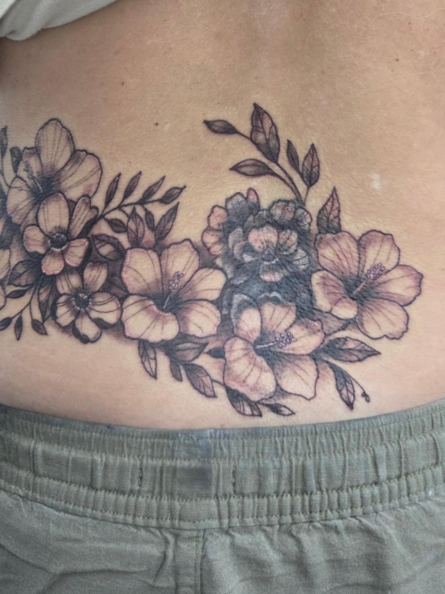 Floral bouquet black and grey tattoo on the ribs by Matthew Todd Kremer