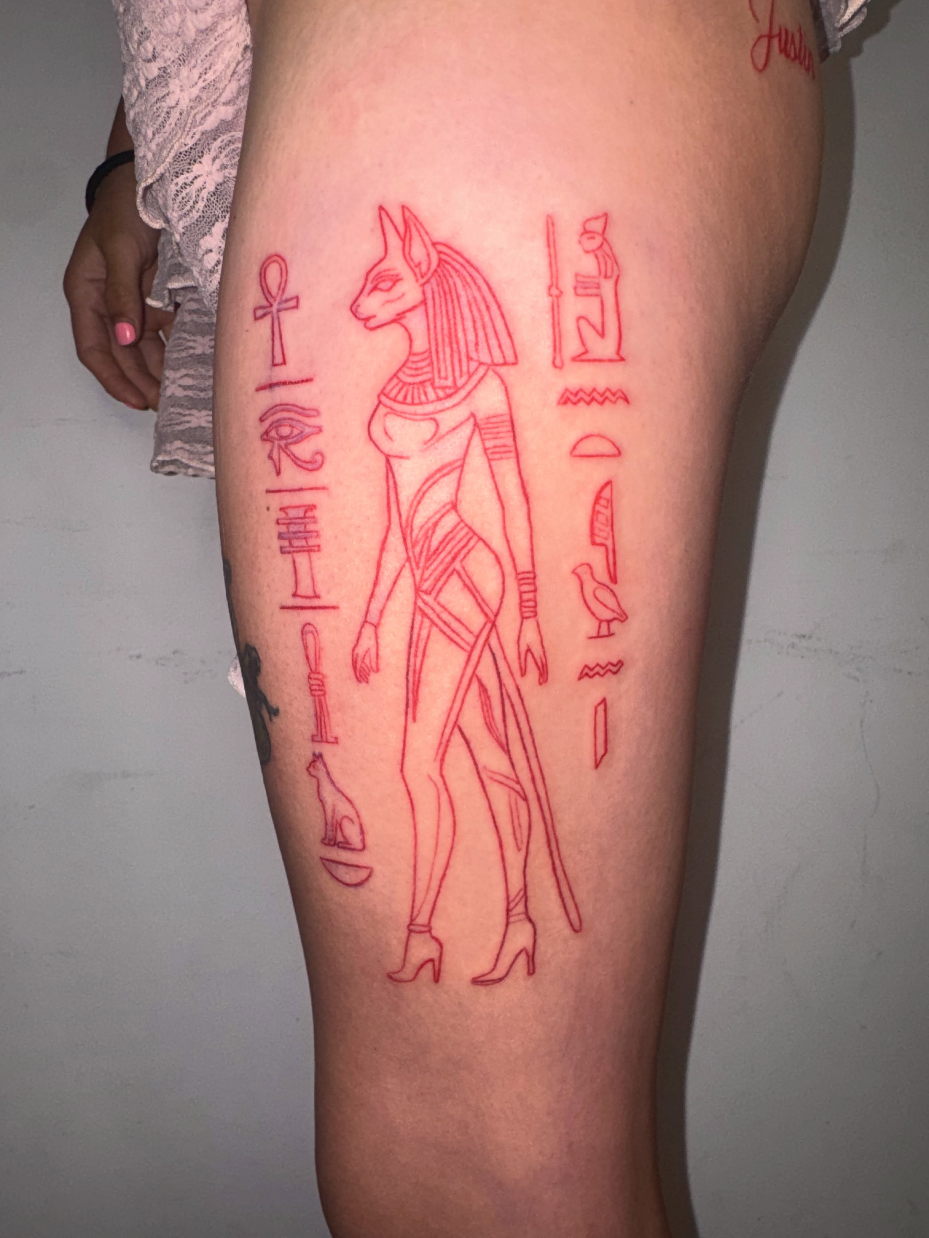 Ancient egyptian deity fine line tattoo on the thigh by Comet