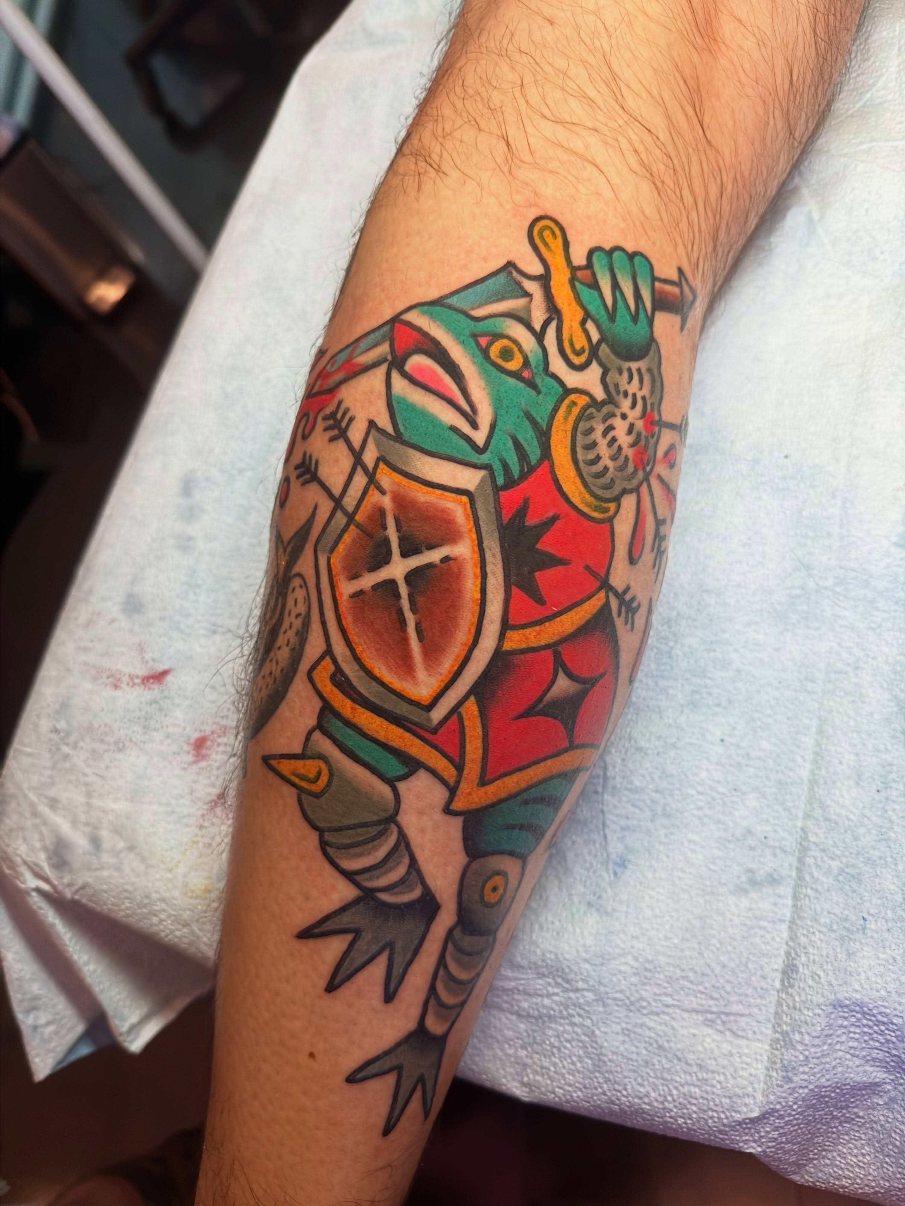 Fish knight American traditional tattoo on the forearm by Chris Bishop