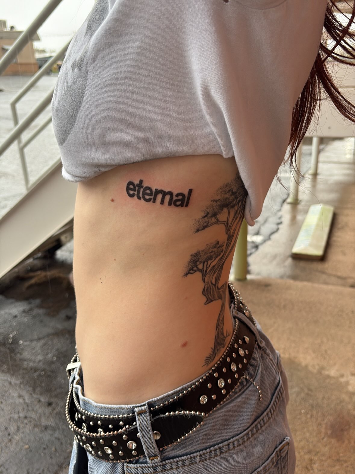 Tree black and grey tattoo on the ribs by Sierra Maynard