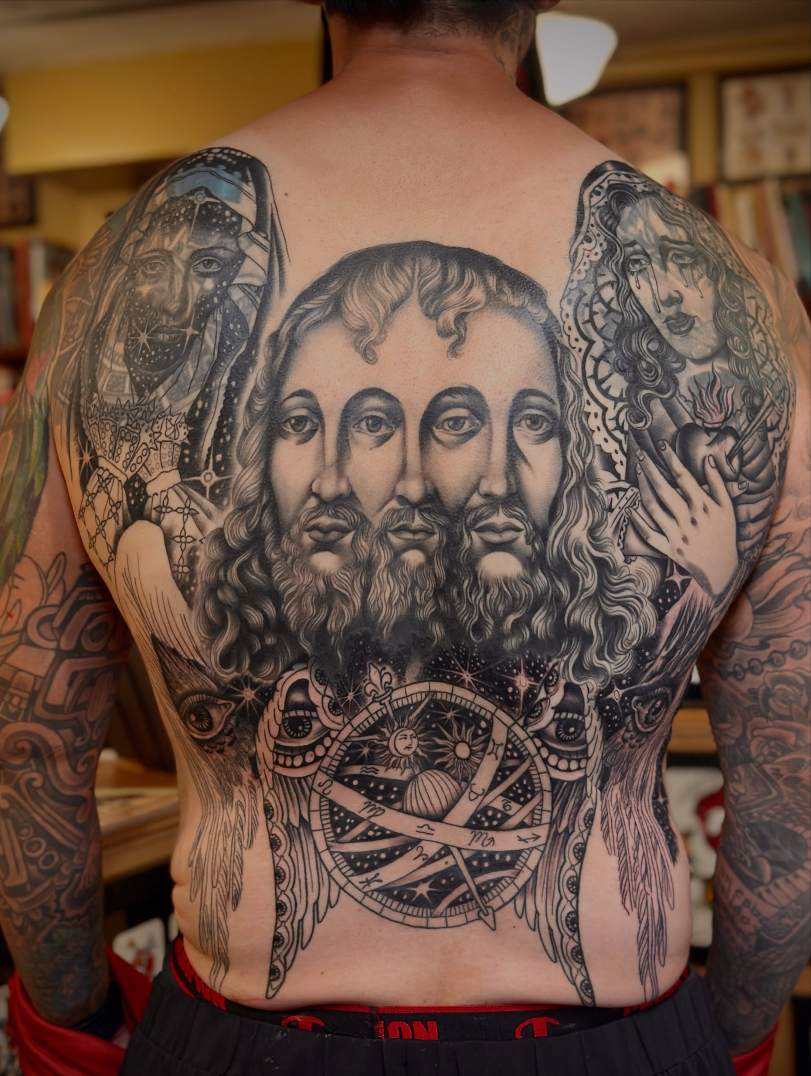 Religious triptych realism tattoo on the back by Holly Ellis, San Francisco, California