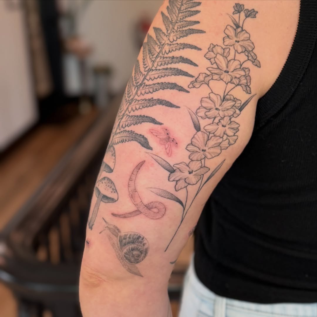 Floral and botanical black and grey tattoo on the forearm by 🖤🥀🐉Taylor Nichole👻🌙✨️