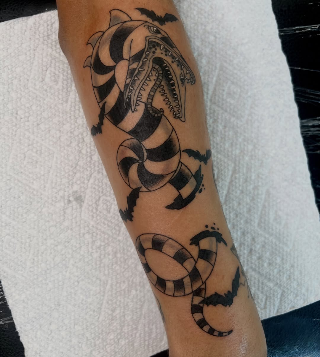Snake and shark black and grey tattoo on the forearm by Kahlan ⍟