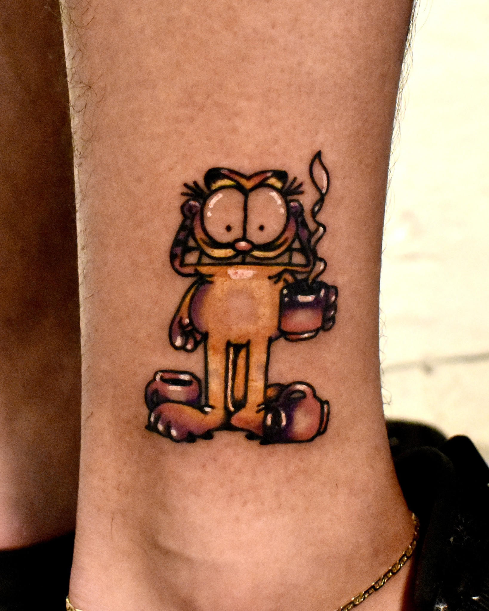 Garfield new school tattoo on the forearm by Mackz