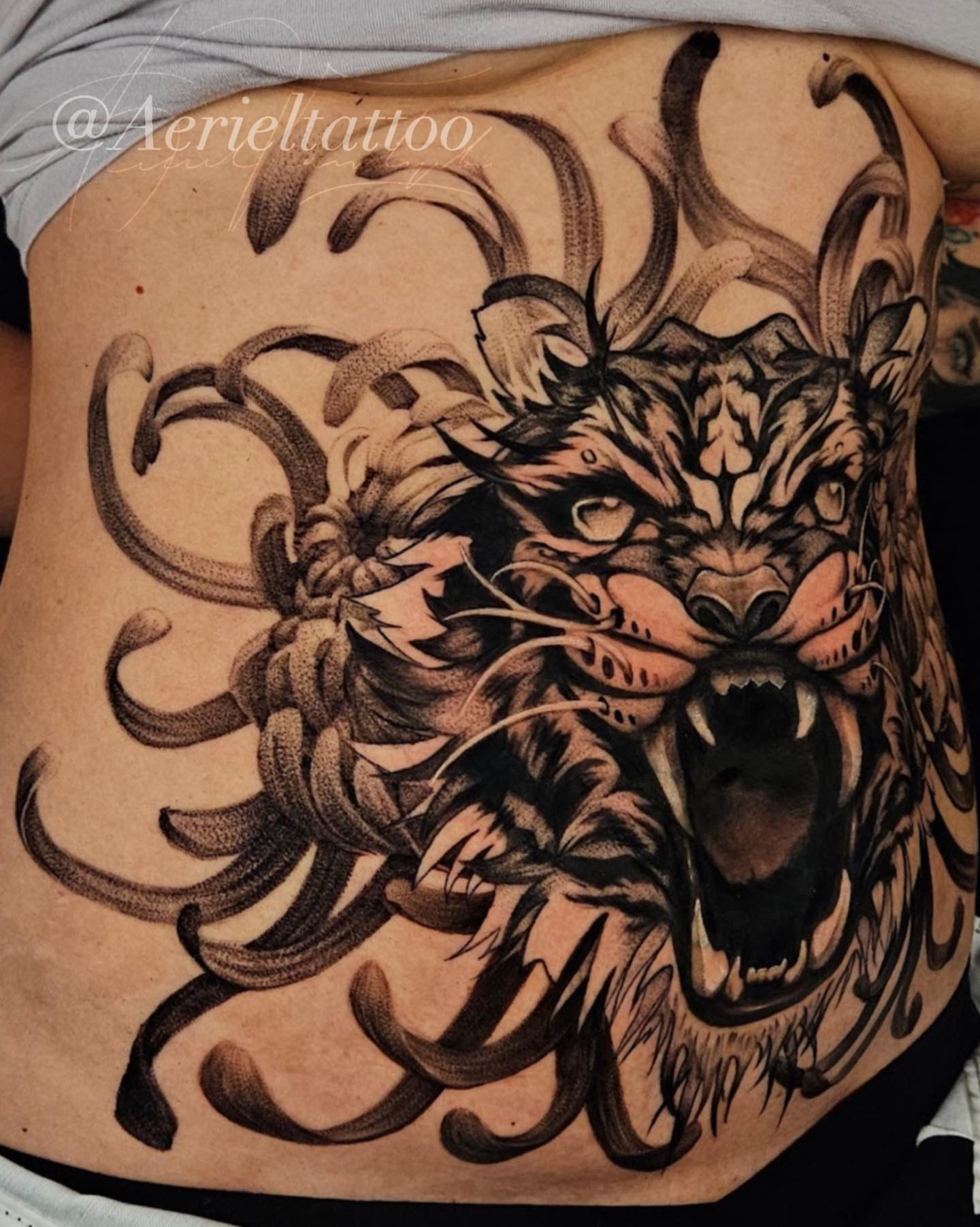 Tattoo by @aerieltattoo — dotwork, realism